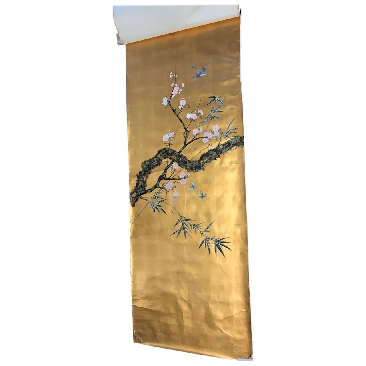 The four panels were hand decorated in New York City the 1980's. The background material was made in Gracie studio in Hong Kong. 
The hand leafed gilded wallpapers are adorned with blooming cherry blossom tree and three vibrantly colored birds.