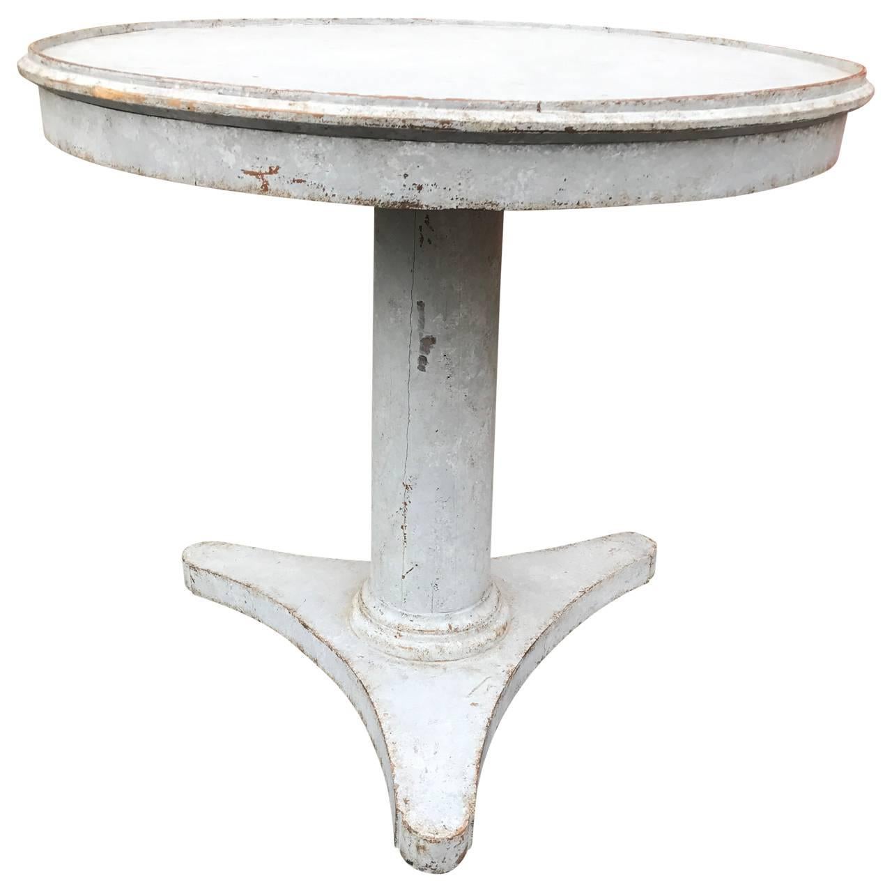 Period Swedish painted pedestal table with profiled top.