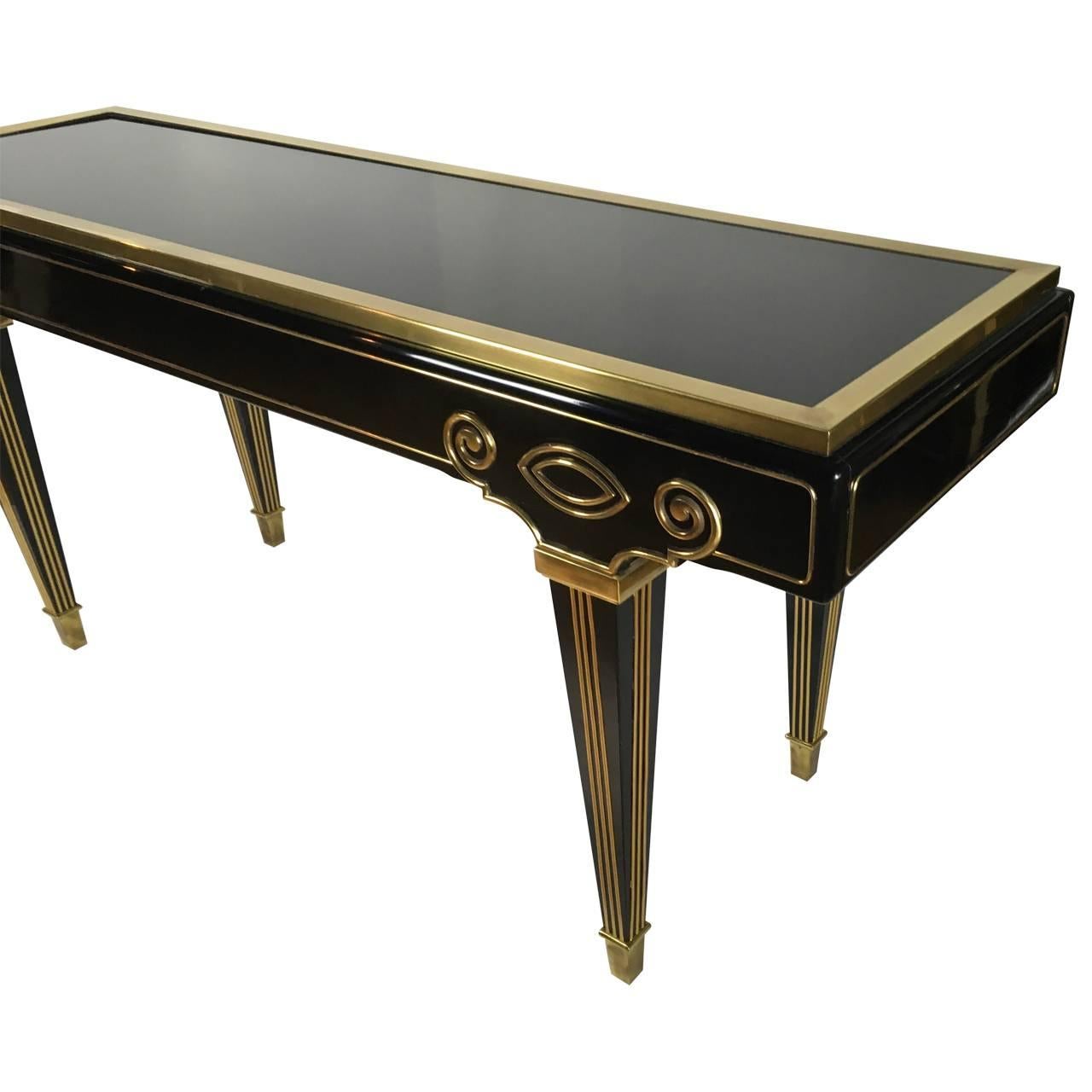 Black lacquered console table with unique brass details by Mastercraft USA, circa 1980s rare design, exceptional table with original finish.