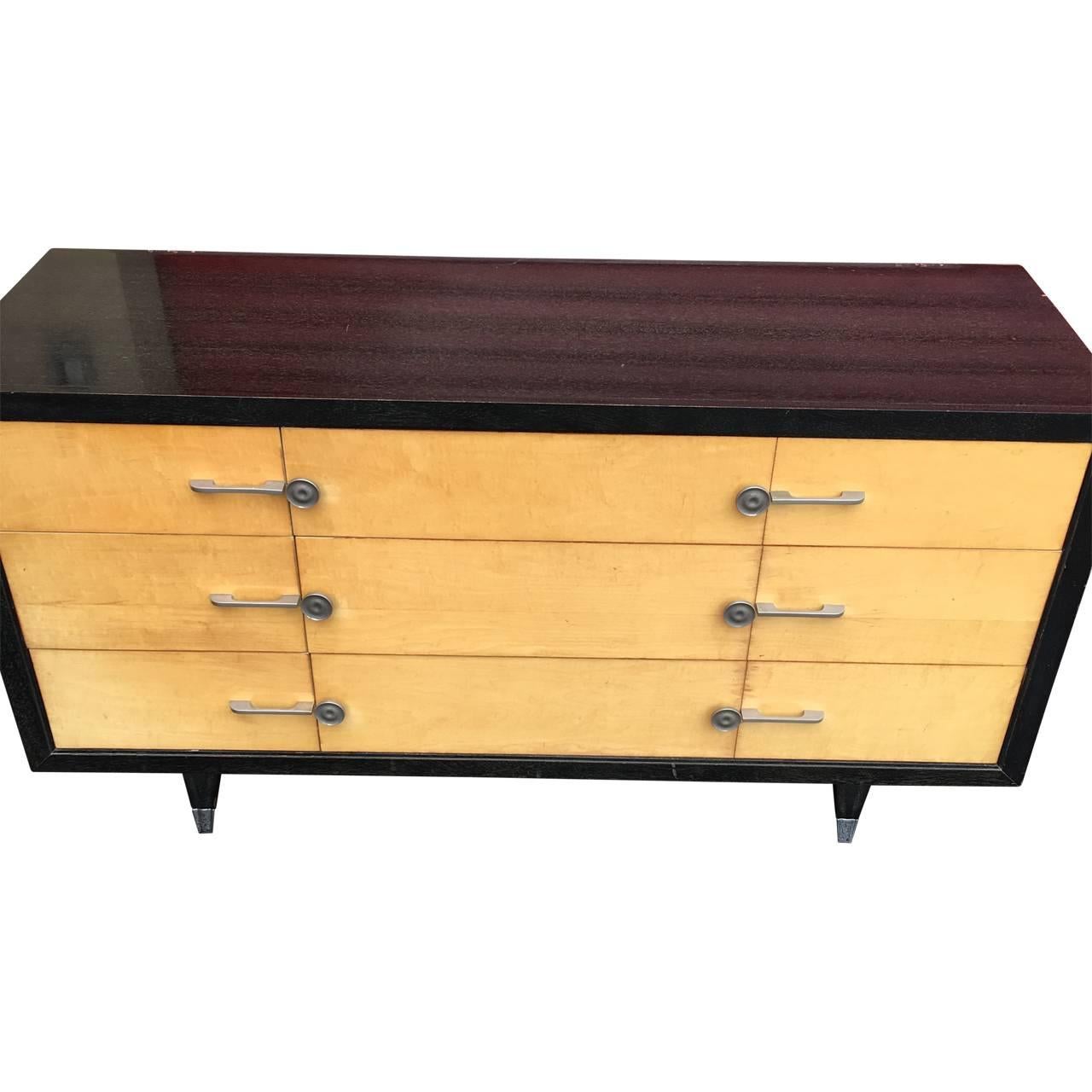 Nine-drawered cerused wood and faux parchment commode by Sieling Modern of Railroad, PA.
Commode is on black splayed legs with chrome-capped feet and with makers mark inside drawer.
The original mirror part that attaches to the rear side of the