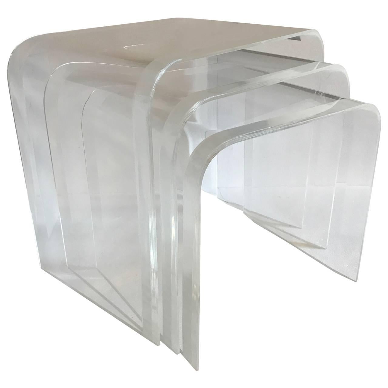 Set of thick Lucite waterfall nesting side tables. Edge on tables has a rare 1.5 inch wide bevelled edge.

Complementary front door delivery to New York City