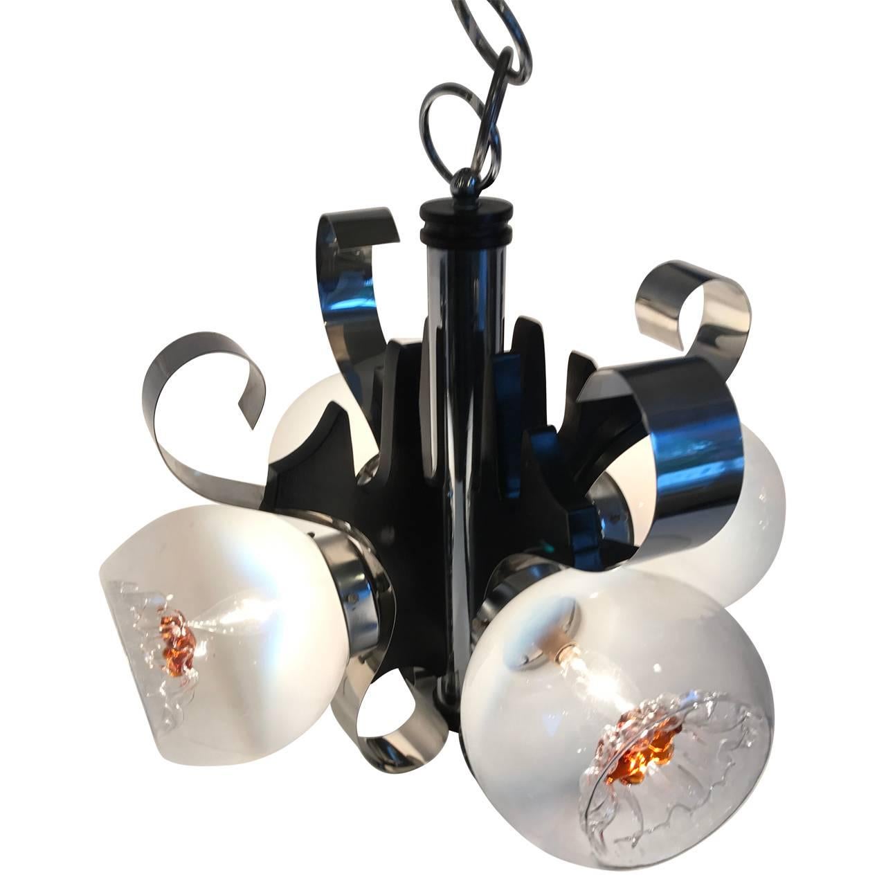 Italian Midcentury four-light ceiling pendant.
Oh, this light fixture is fun in any modern decor! The thick polished chrome gently curves around the frosted glass globes. The ceiling pendant light is perfect for a bathroom, a kitchen light or a