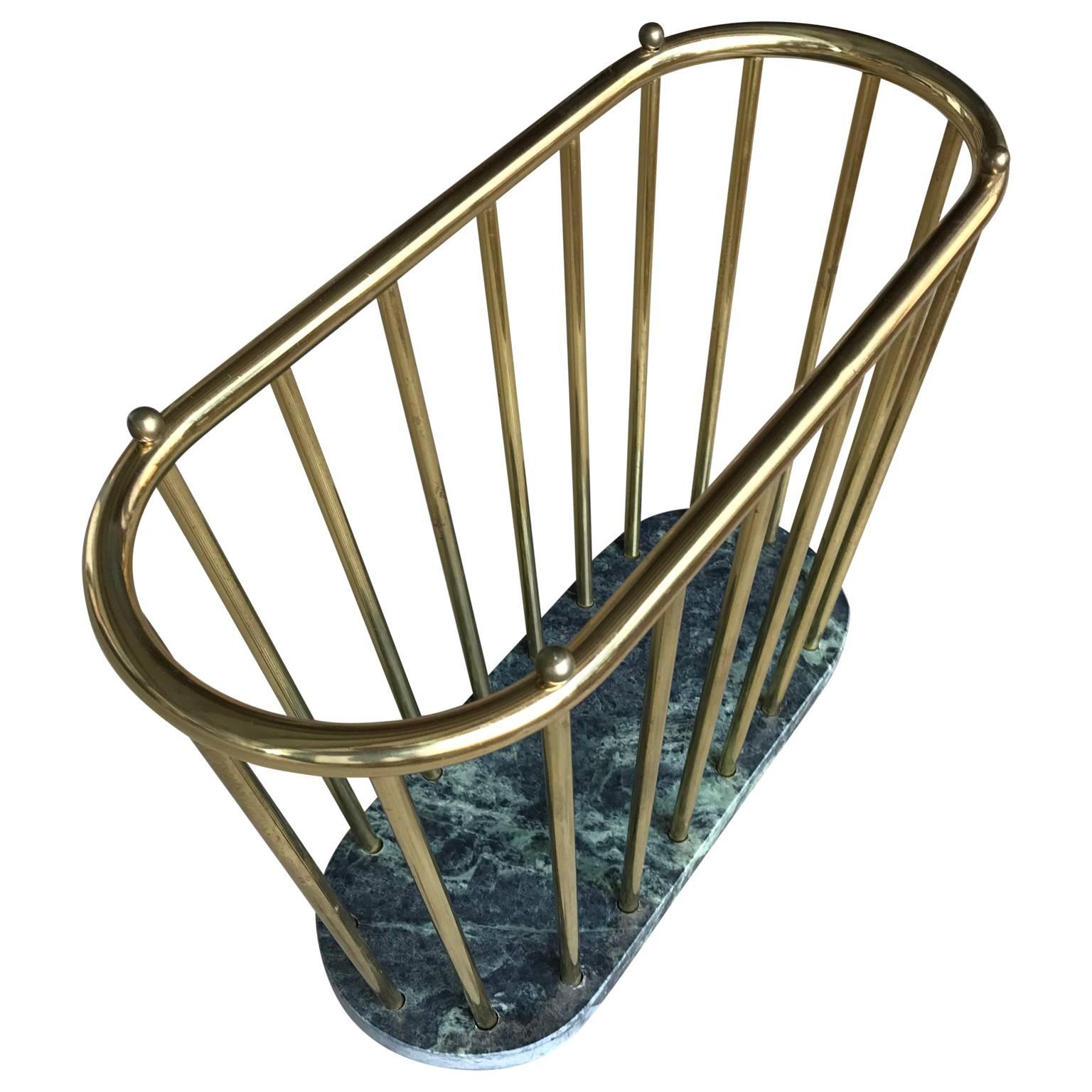 Italian magazine rack on a marble base.