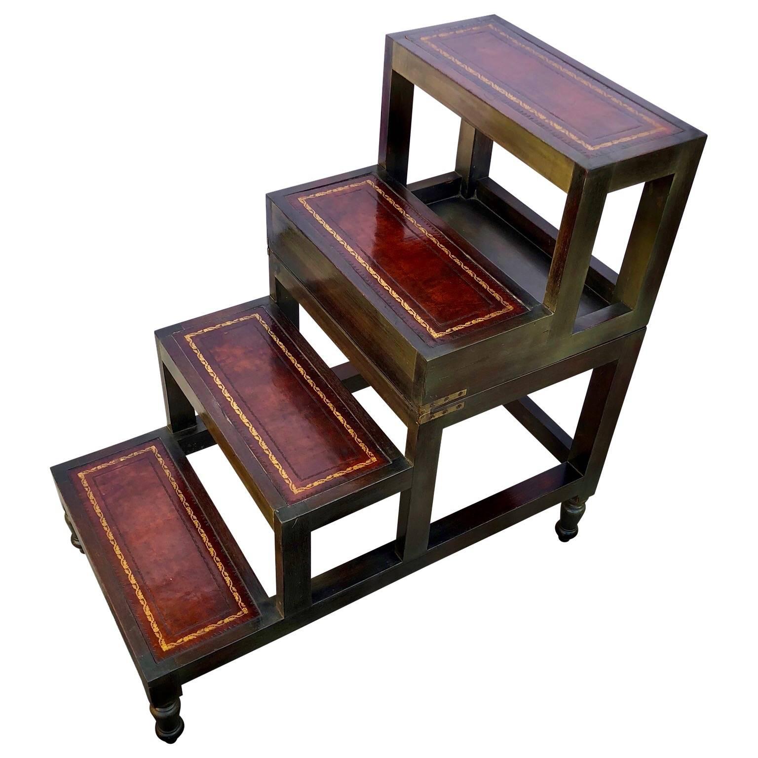 1930's library steps and or side table with decorative gilt incised leather top and leathered steps

The steps measures 27.5 in height when it is opened to steps.
 