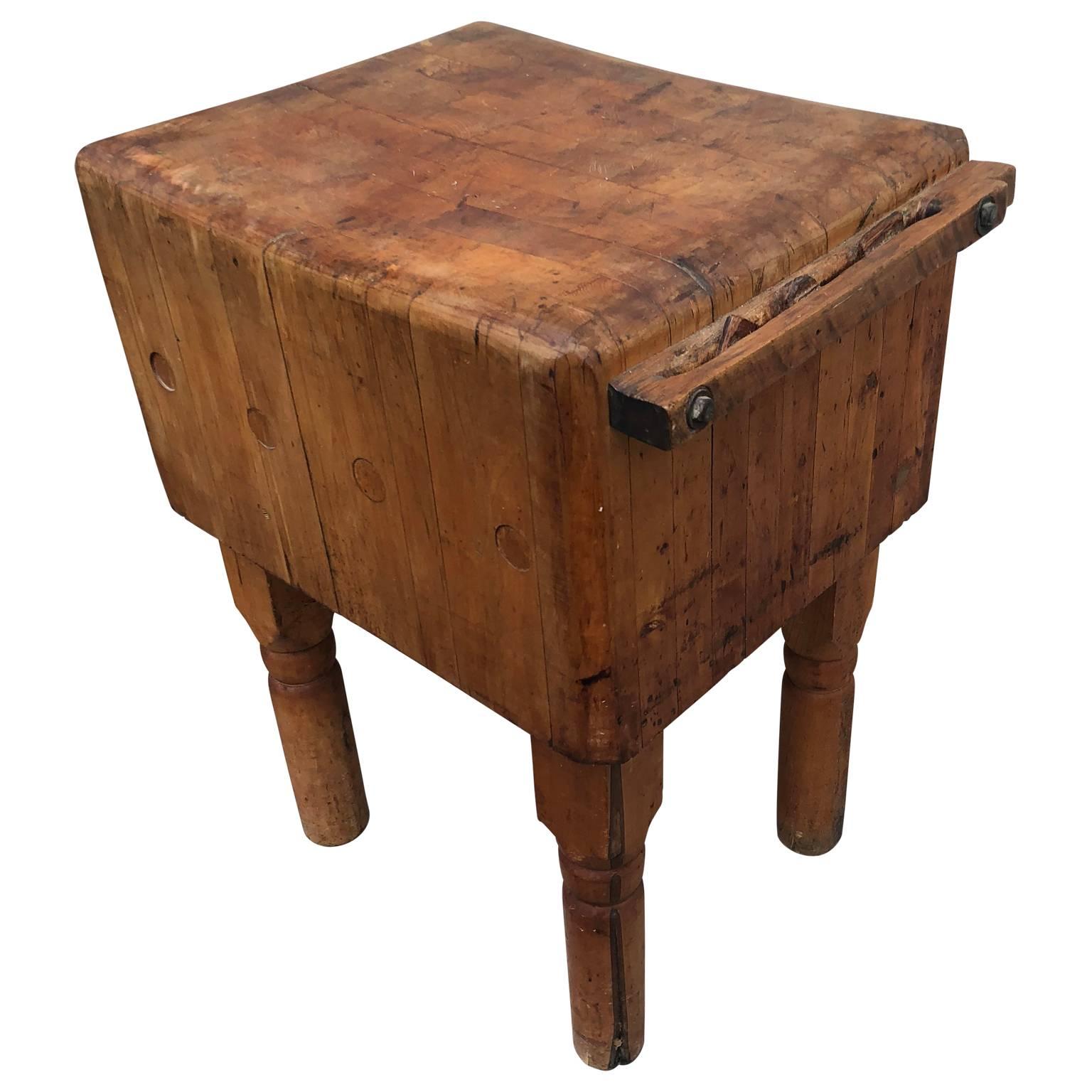 Large vintage maple butchers block on four detachable legs. The block is in good sturdy condition.

 