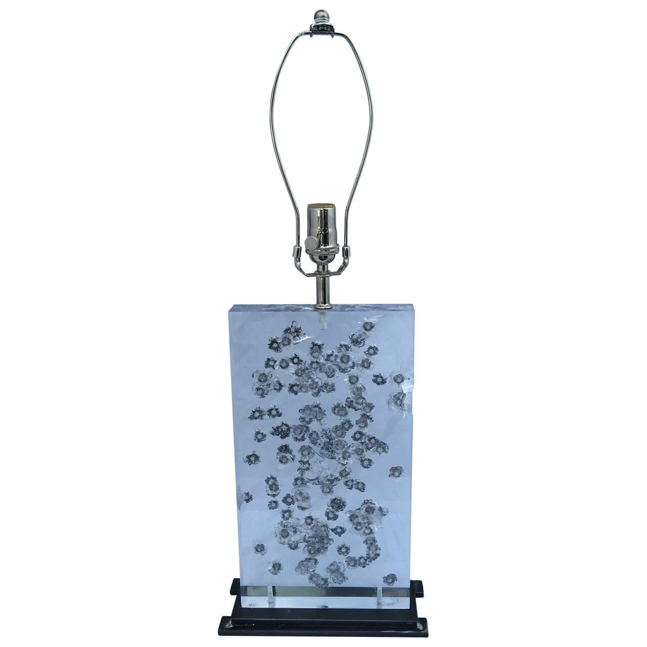 Single table lamp of thoroughly tested bulletproof glass; on a hand-crafted patinated metal stand. Measures: 1 ½ thick.