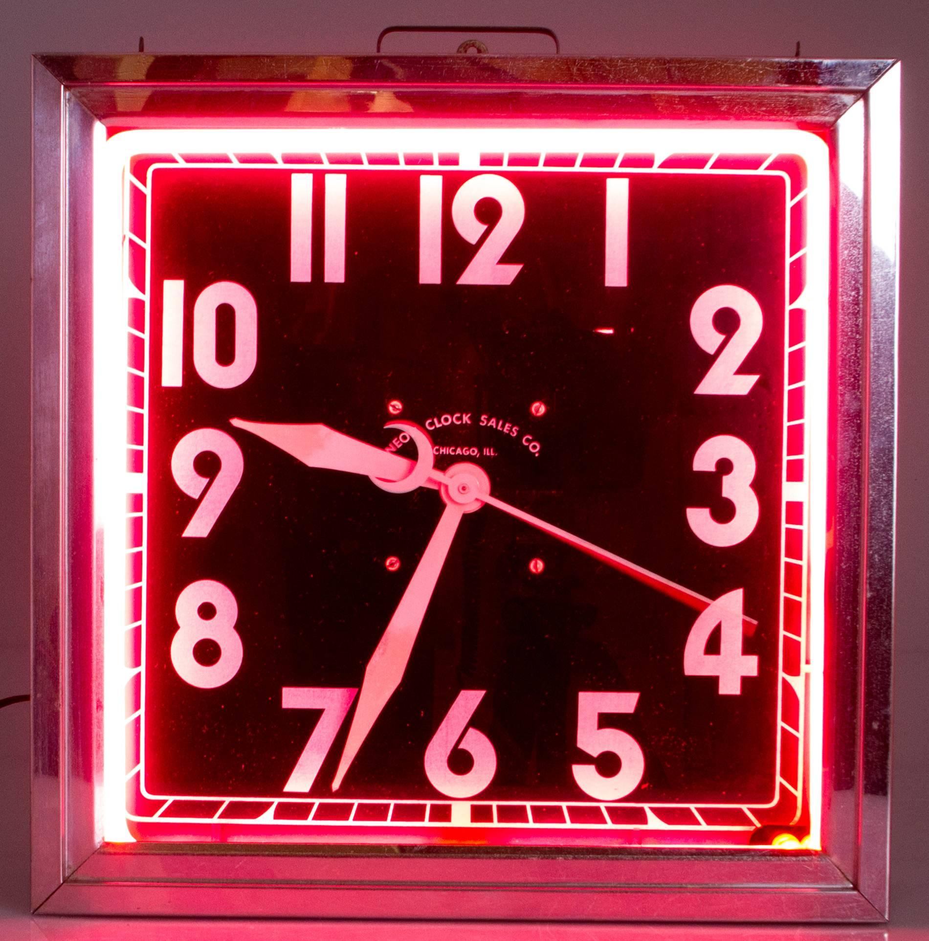 This is a handsome electric neon clock having a green body with a chrome frame.