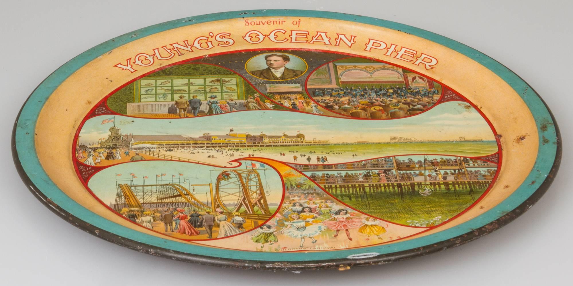 This metal bar tray that shows glimpses of all the marvels of the New Jersey Boardwalk and is made by the CW Shonk Co of Chicago.