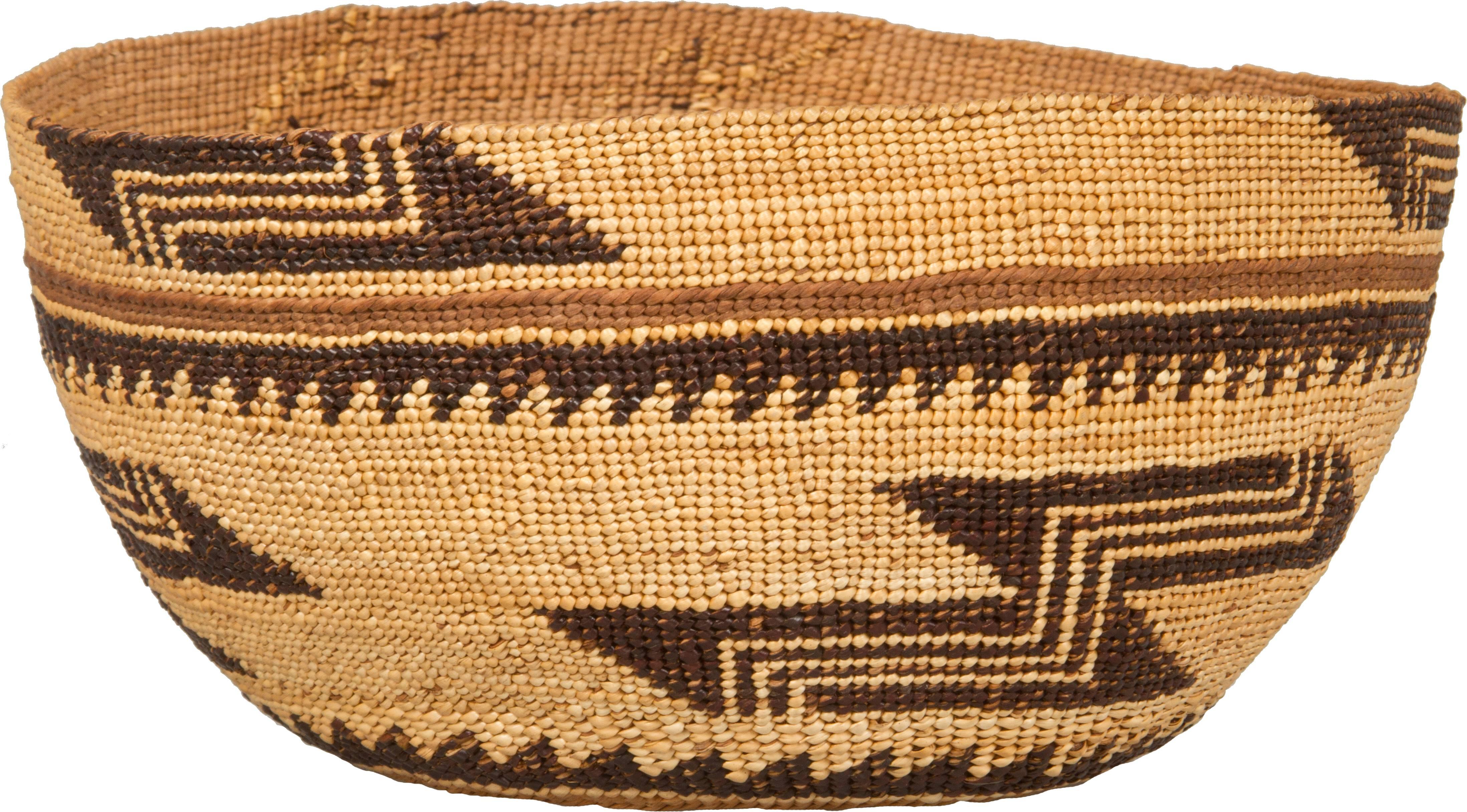 This is a wonderful and fine example of a California Native American Hupa basket. The colors are strong, graphic and the basket is very clean. There is a nice detail on the bottom.