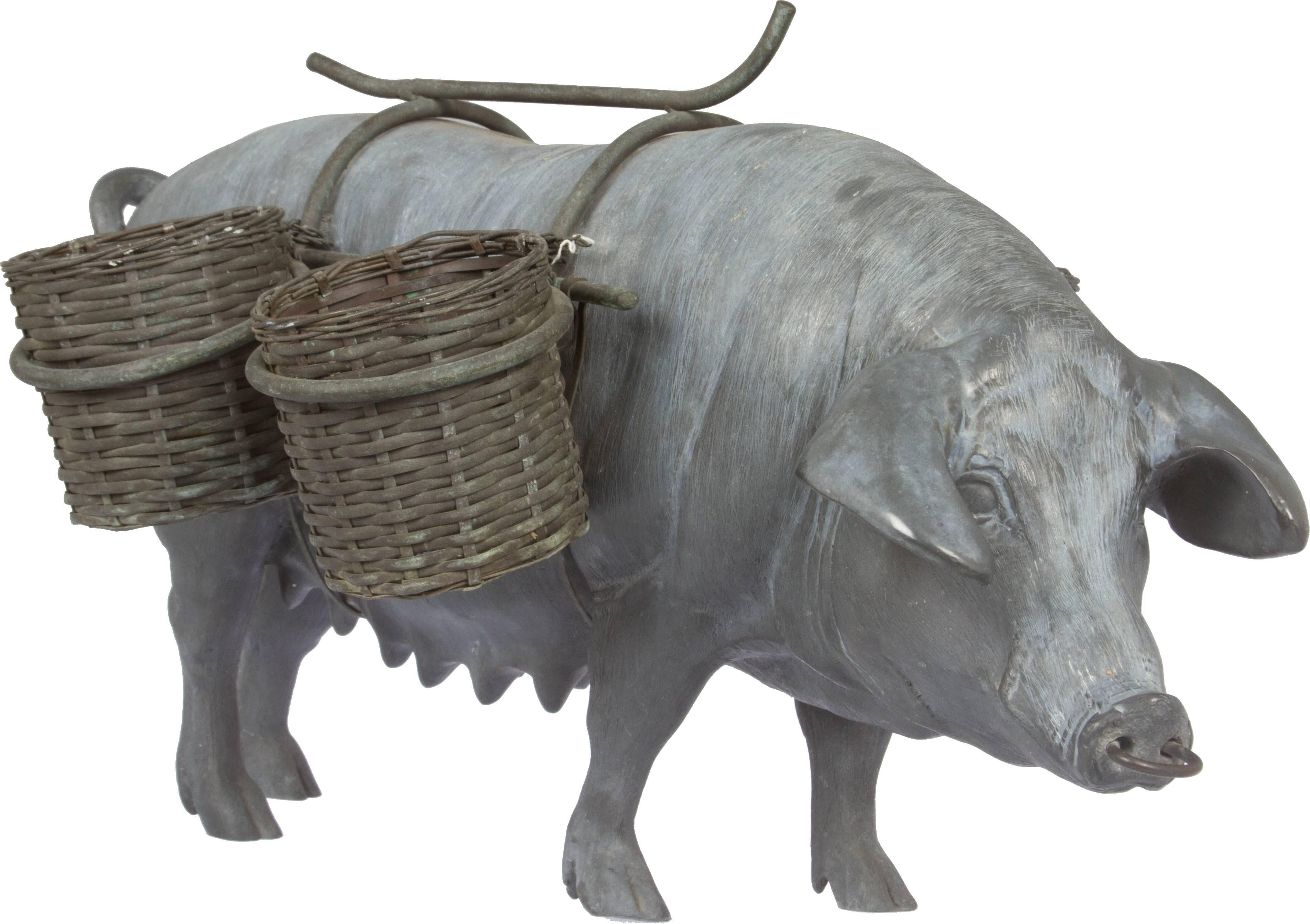 Four woven Brass baskets are carried by this sow. She is heavy and very well cast and life like.