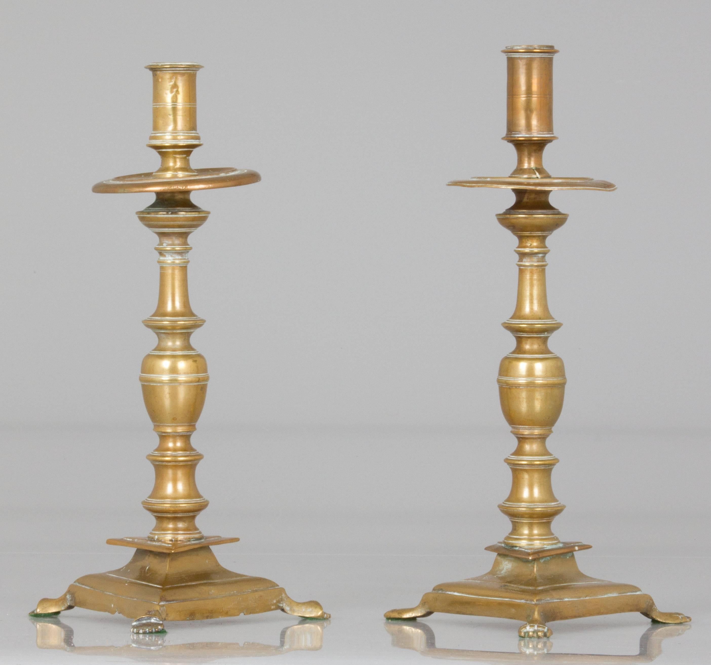 English Two Near Pairs of Brass Footed Candleholders