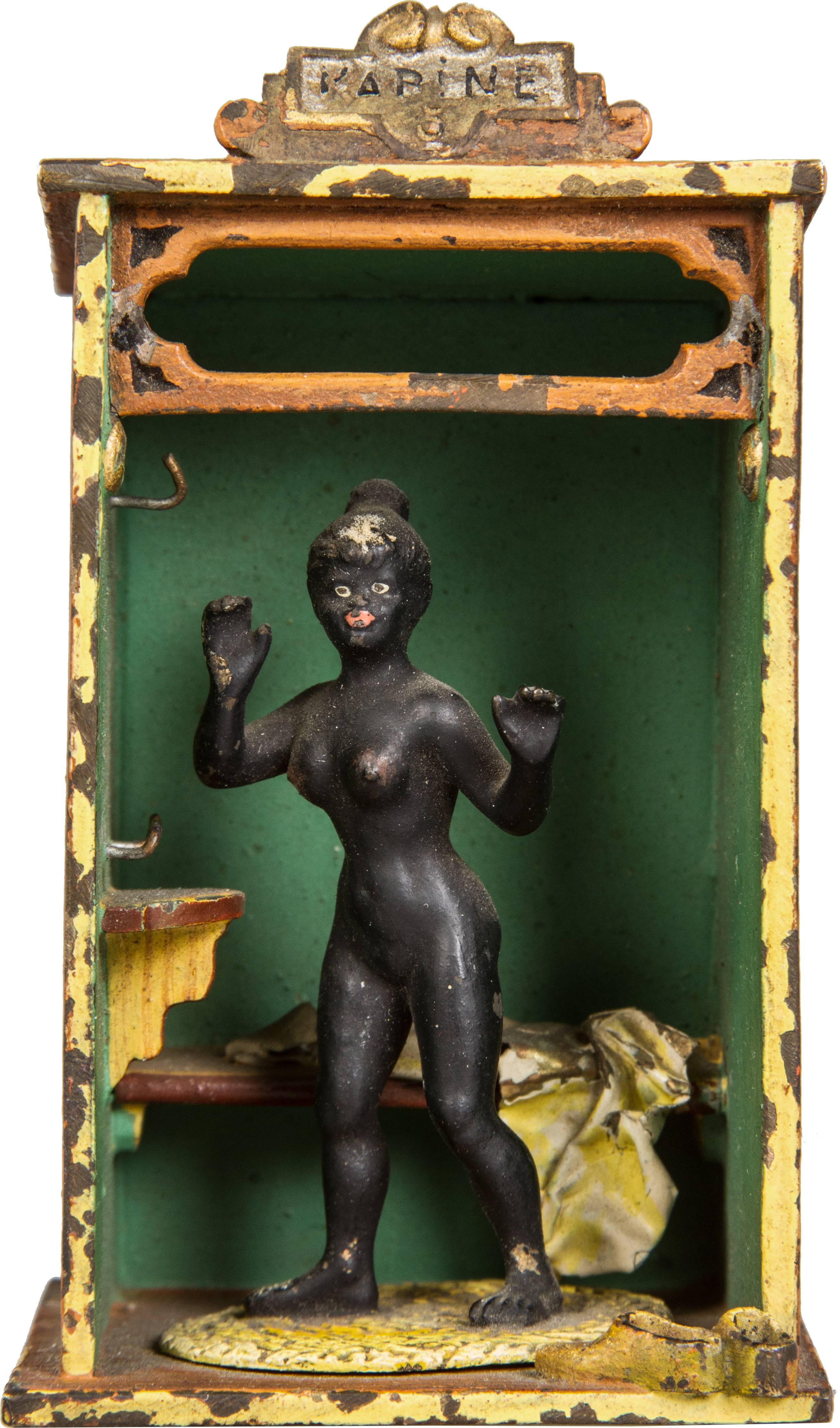 This is a whimsical cold painted bronze depicting a startled lady. We believe it originally had a fabric curtain.