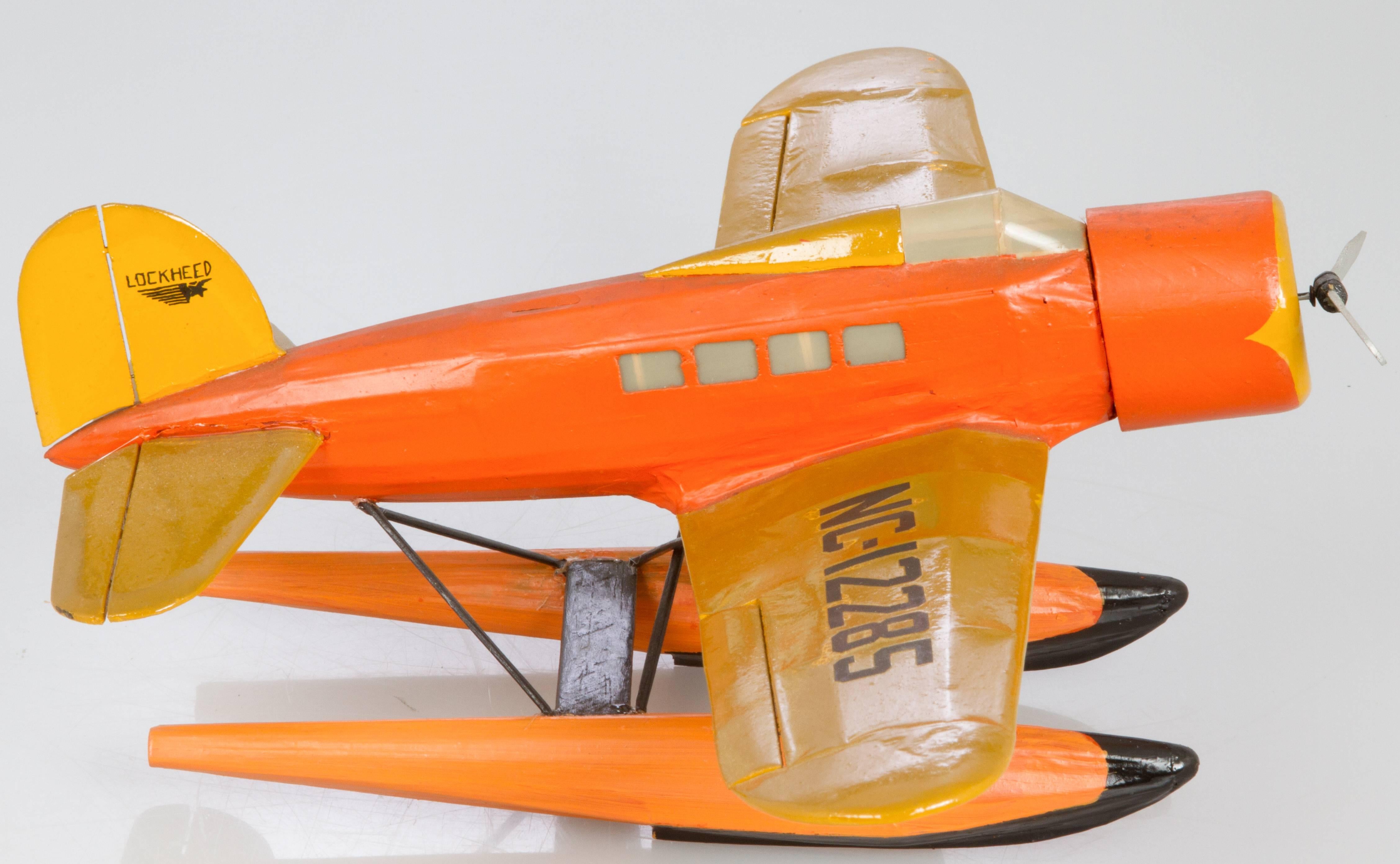 This is a handmade model, we believe from the 1930s. Light weight, made from balsa wood. This model is similar to Wiley Post's Lockheed Orion/ Explorer which crashed in Alaska with Wiley Post and Will Rogers.