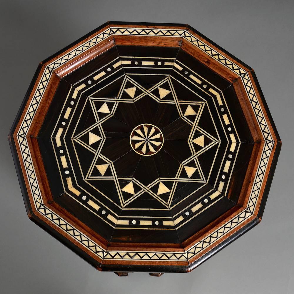 A Damascus walnut and ebony table inlaid with ivory and mother-of-pearl, circa 1890.