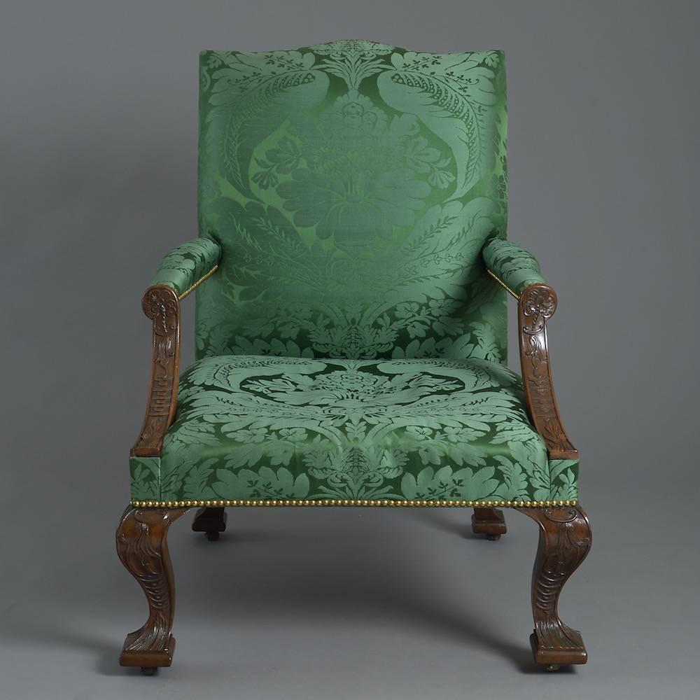 A fine and unusual pair of large George II mahogany library chairs, circa 1750.