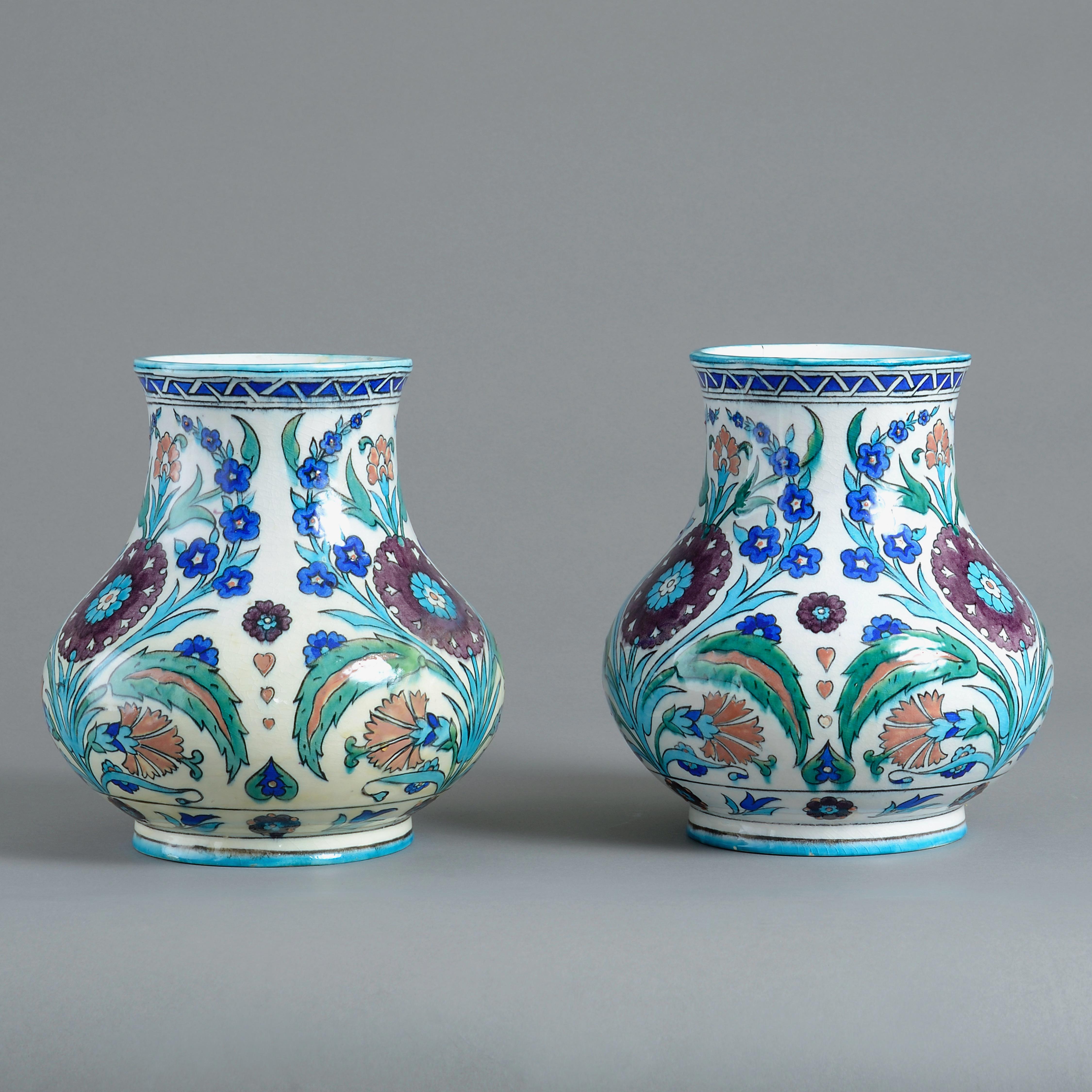 A PAIR OF IZNIK STYLE POTTERY VASES BY THEODORE DECK, CIRCA 1870.

Each with impressed signature TH DECK