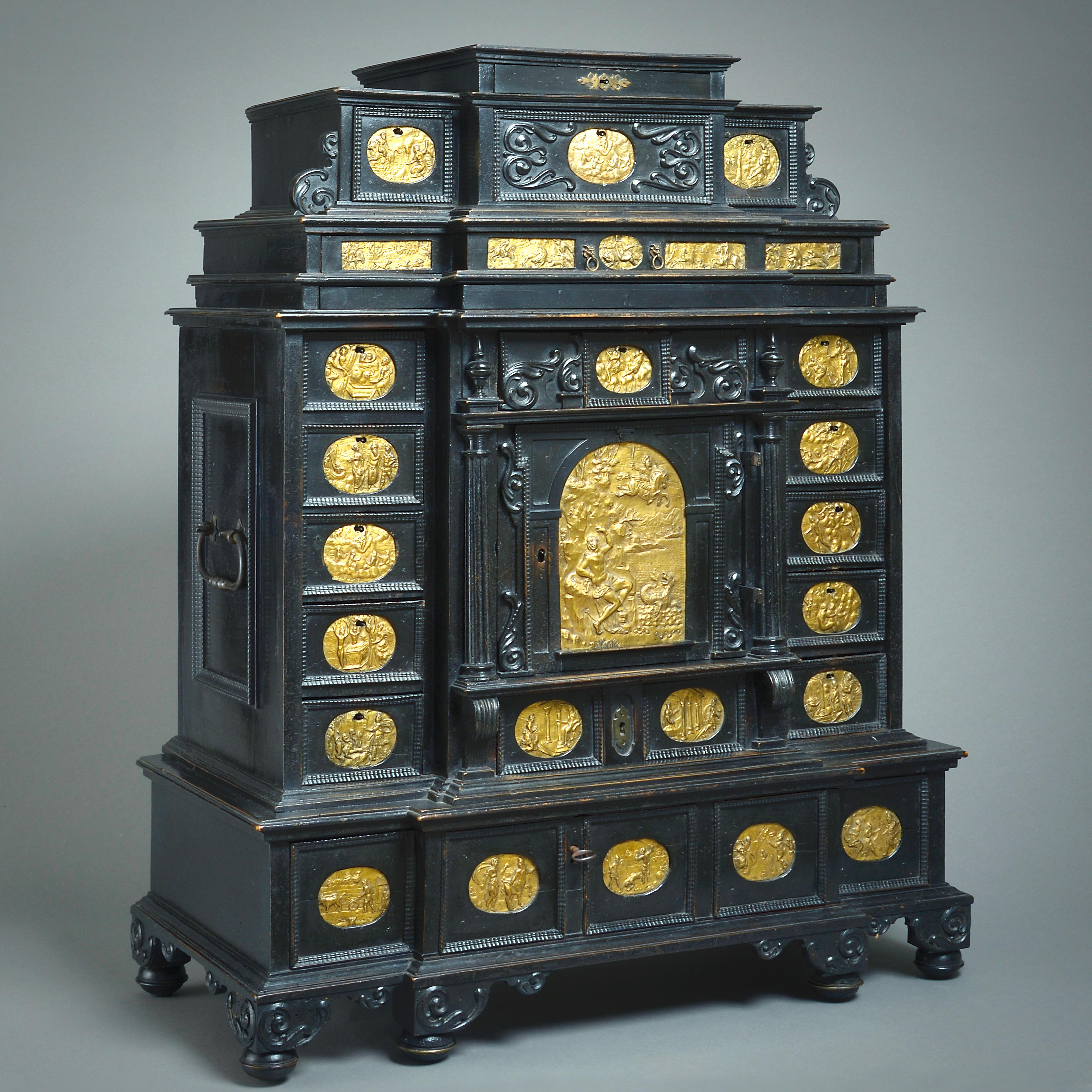 A FINE EARLY 17TH CENTURY EBONISED TABLE CABINET INSET WITH GILT-BRASS PLAQUES, SOUTH GERMANY, PROBABLY AUGSBURG, CIRCA 1630.


The plaques depicting scenes from Ovid’s Metamorphoses.