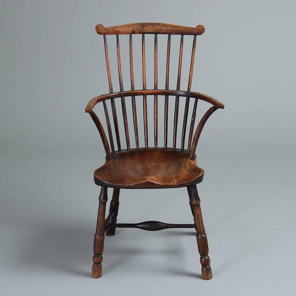 A George III yew wood and elm Windsor chair, circa 1800.