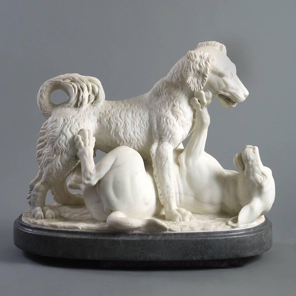 English School, circa 1830.

A carved statuary marble group of dogs at play on a Bardiglio marble base.

Provenance:
James Lees Milne by whom left to 
Deborah, Duchess of Devonshire.


