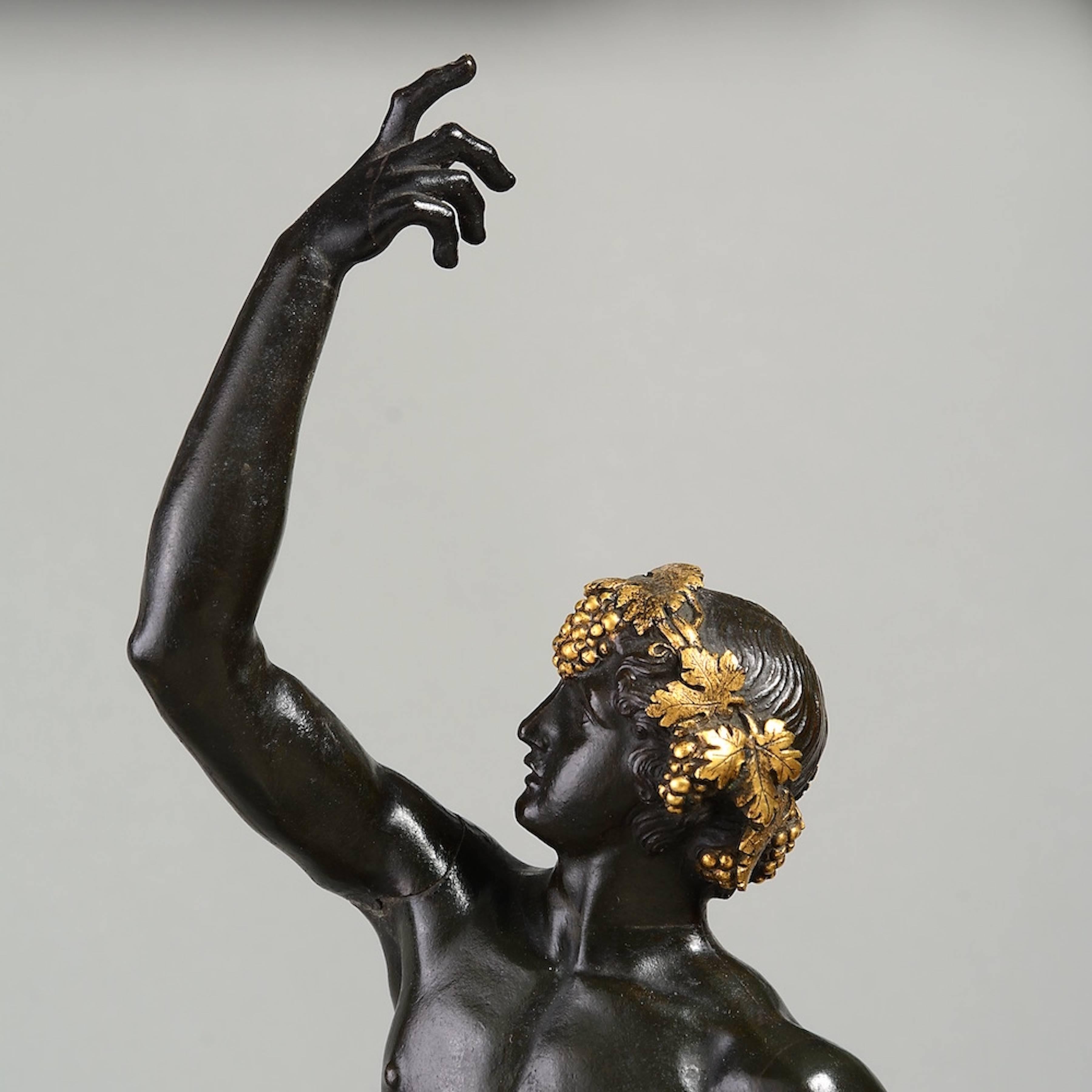 Classical Roman A Roman bronze and gilt bronze figure of a Bacchante