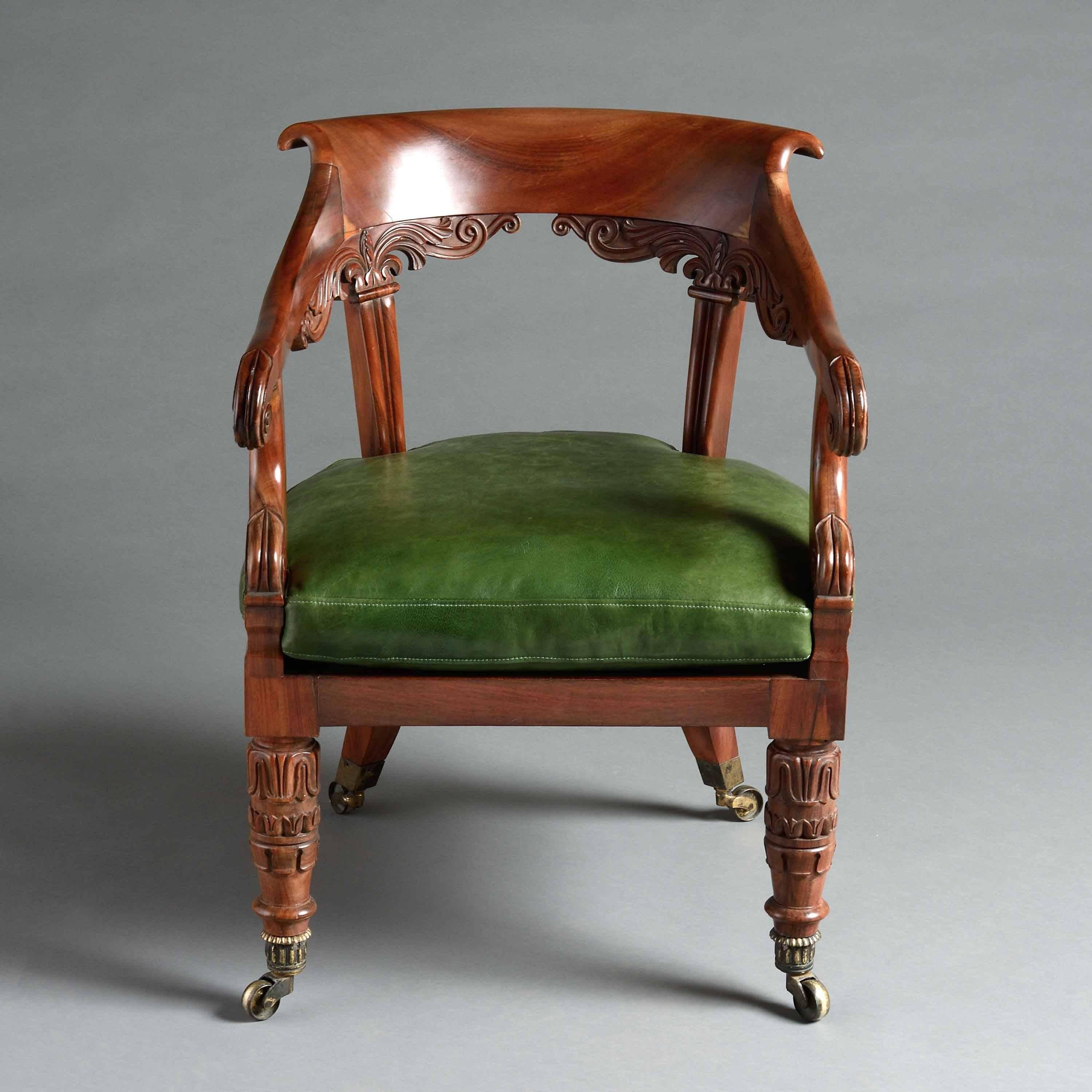 A George IV Goncalo Alves armchair attributed to Gillows, circa 1825.

Carved with lotus leaves and scrolls with curved scroll-over top rail, the original seat squab re-upholstered in green Morocco leather, the legs with original ribbed socket