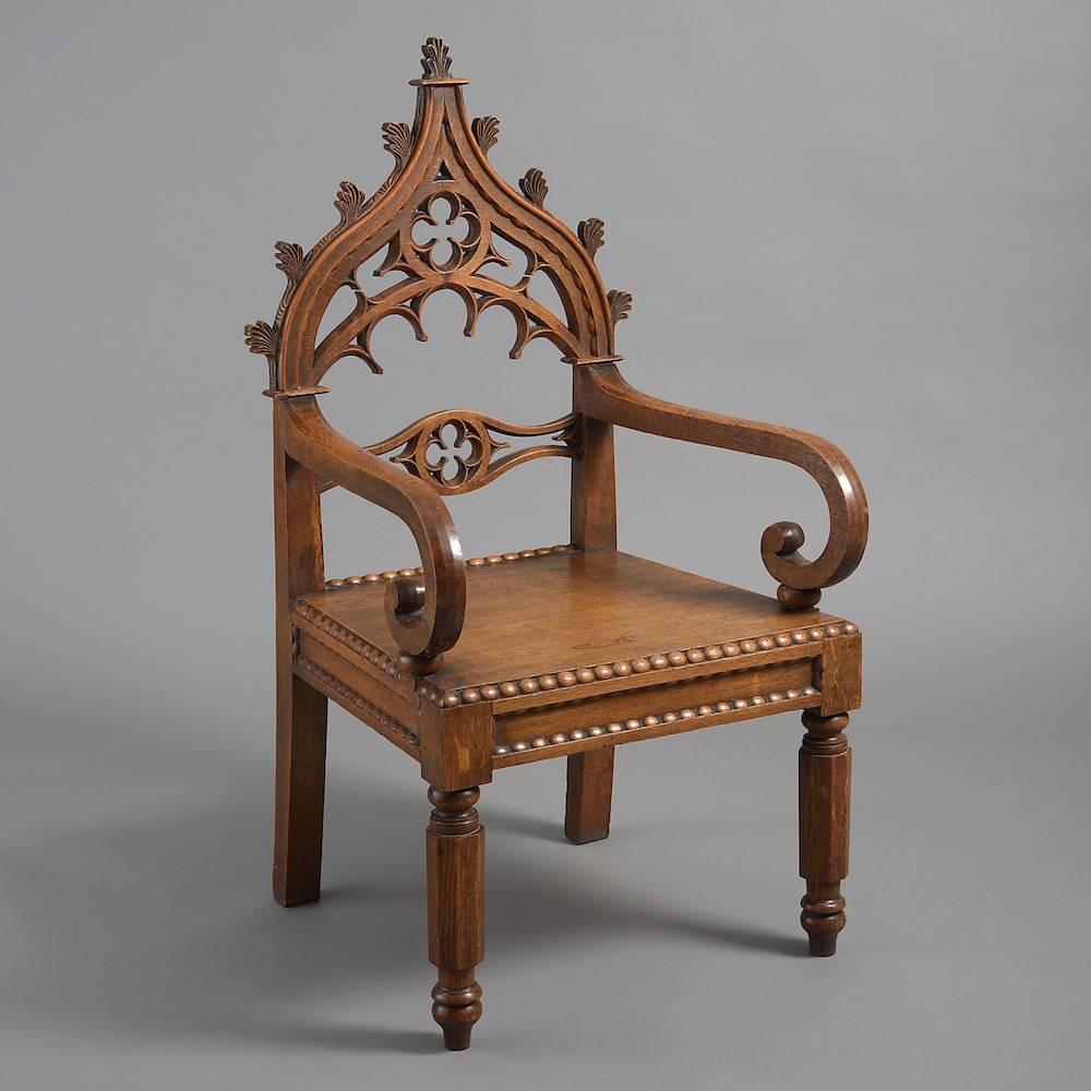 A pair of large William IV Gothic oak armchairs, circa 1835.