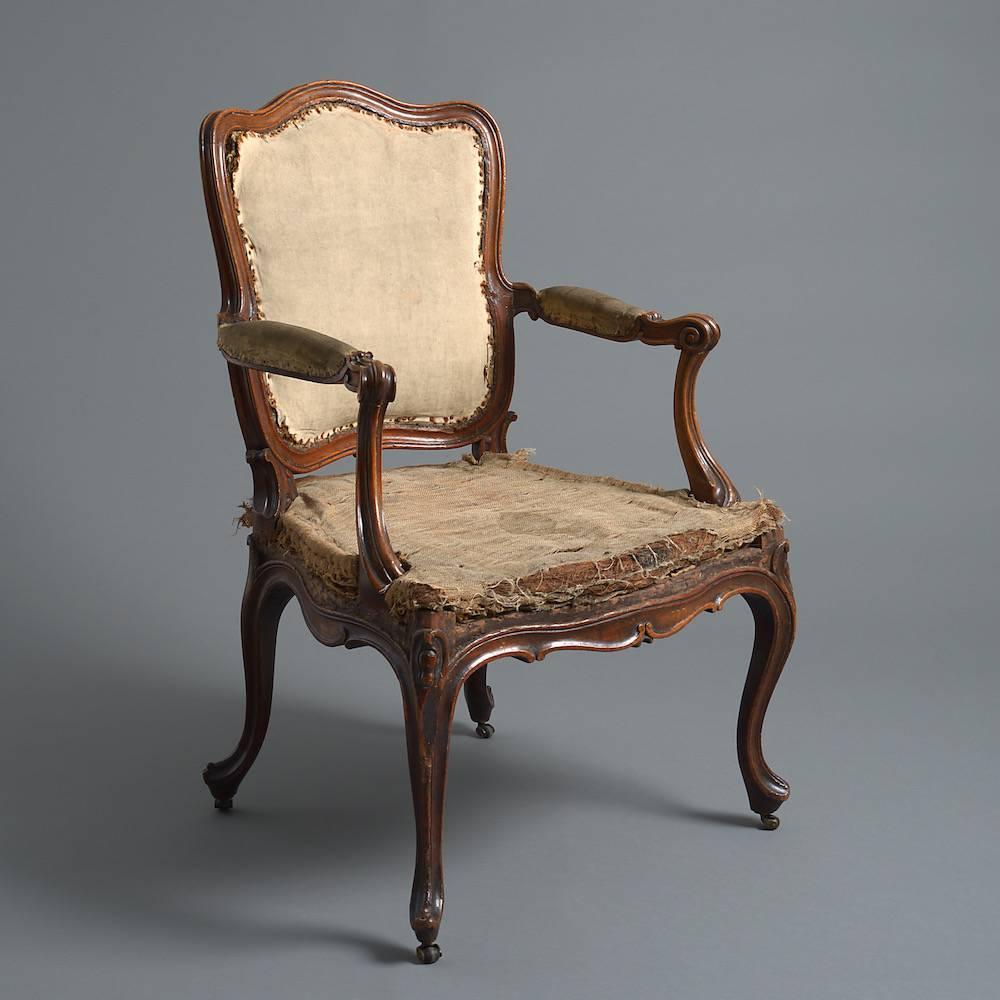 A FINE GEORGE III MAHOGANY OPEN ARMCHAIR IN THE MANNER OF THOMAS CHIPPENDALE, CIRCA 1760.