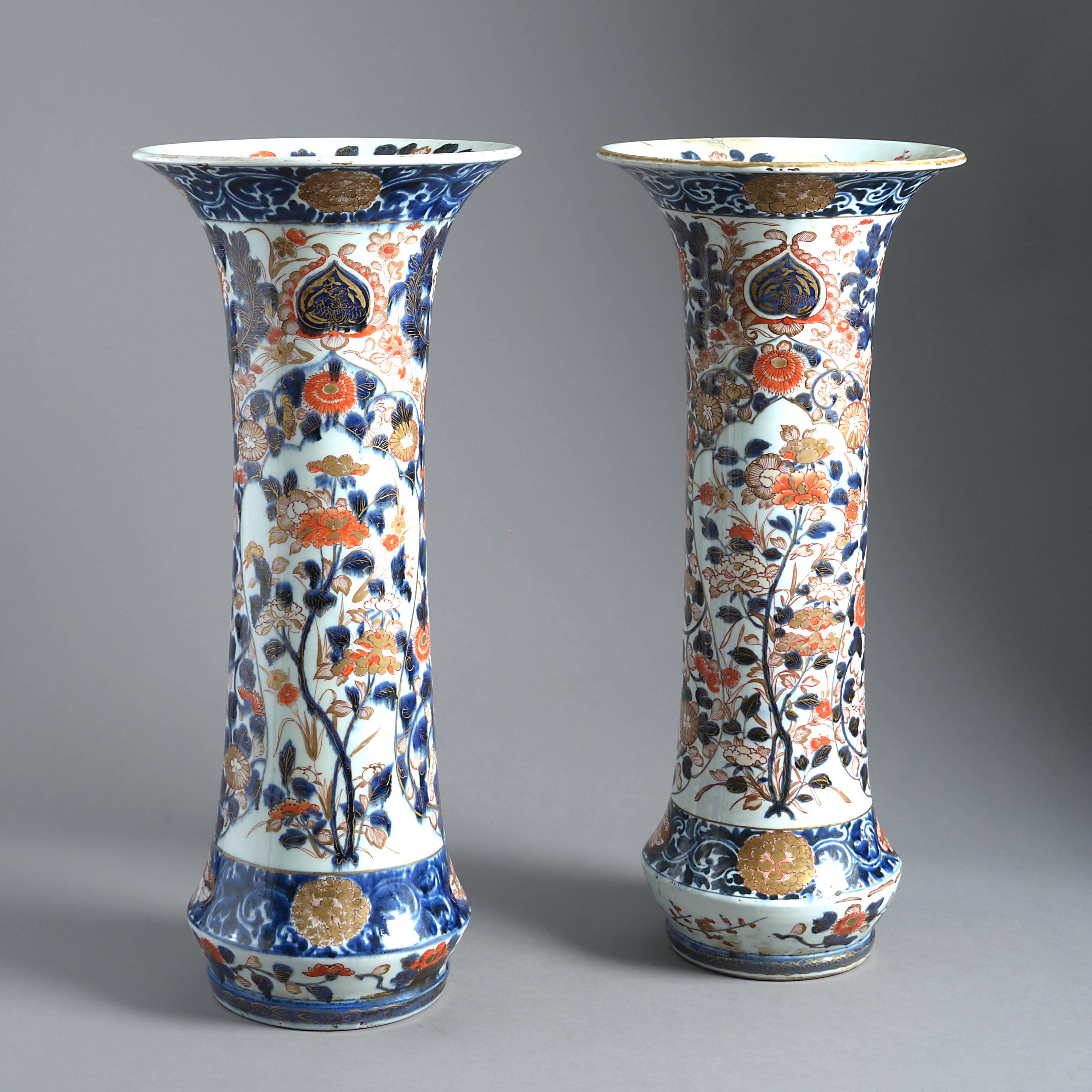 A fine and large pair of Imari trumpet vases, circa 1700.
  