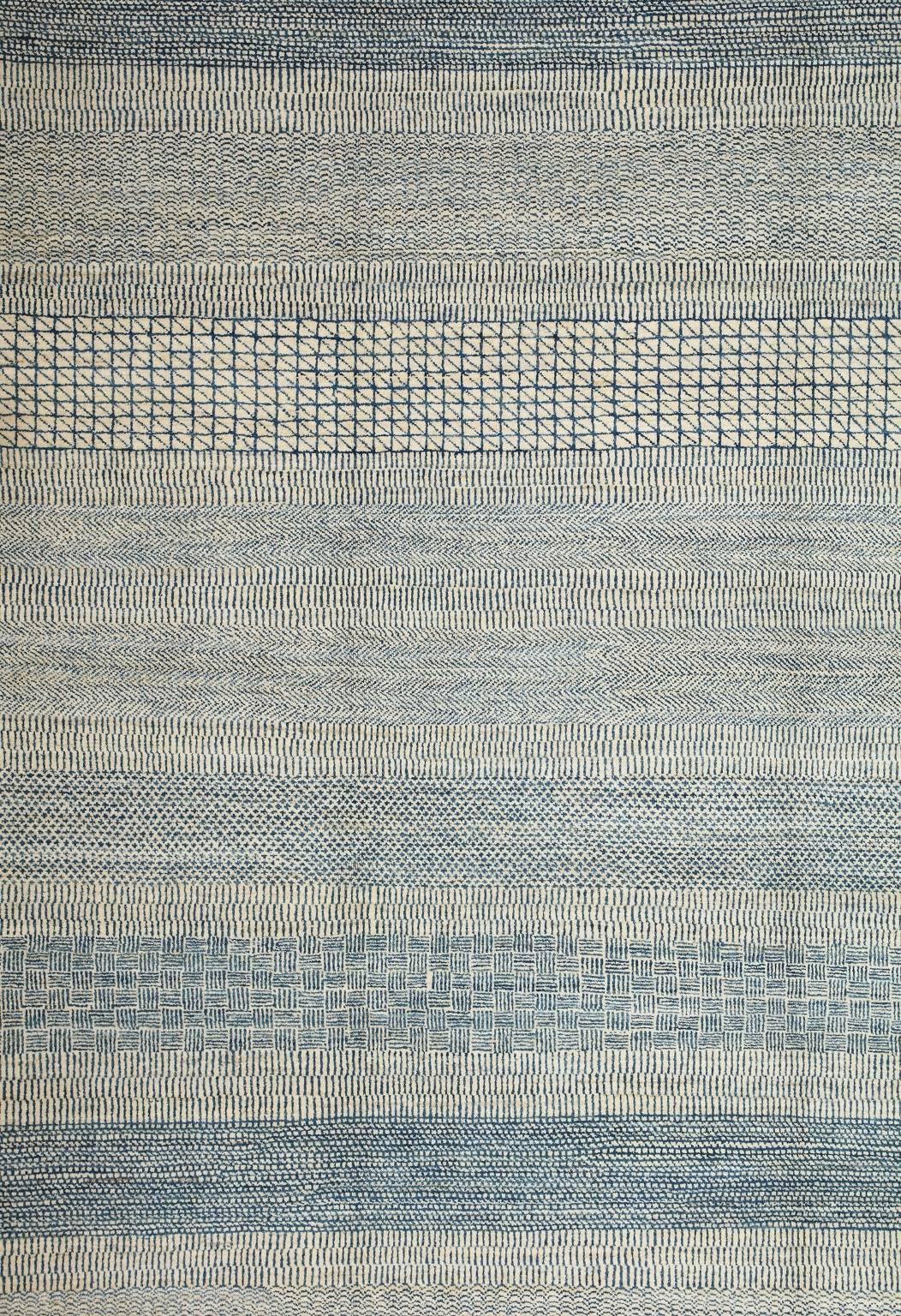 This 8’ x 10’ Orley Shabahang signature “Rain” carpet showcases a modern design in a hand knotted Persian weave. This carpet, from the Orley Shabahang Rain collection, features a simple pattern made from pure handspun wool and organic dyes that