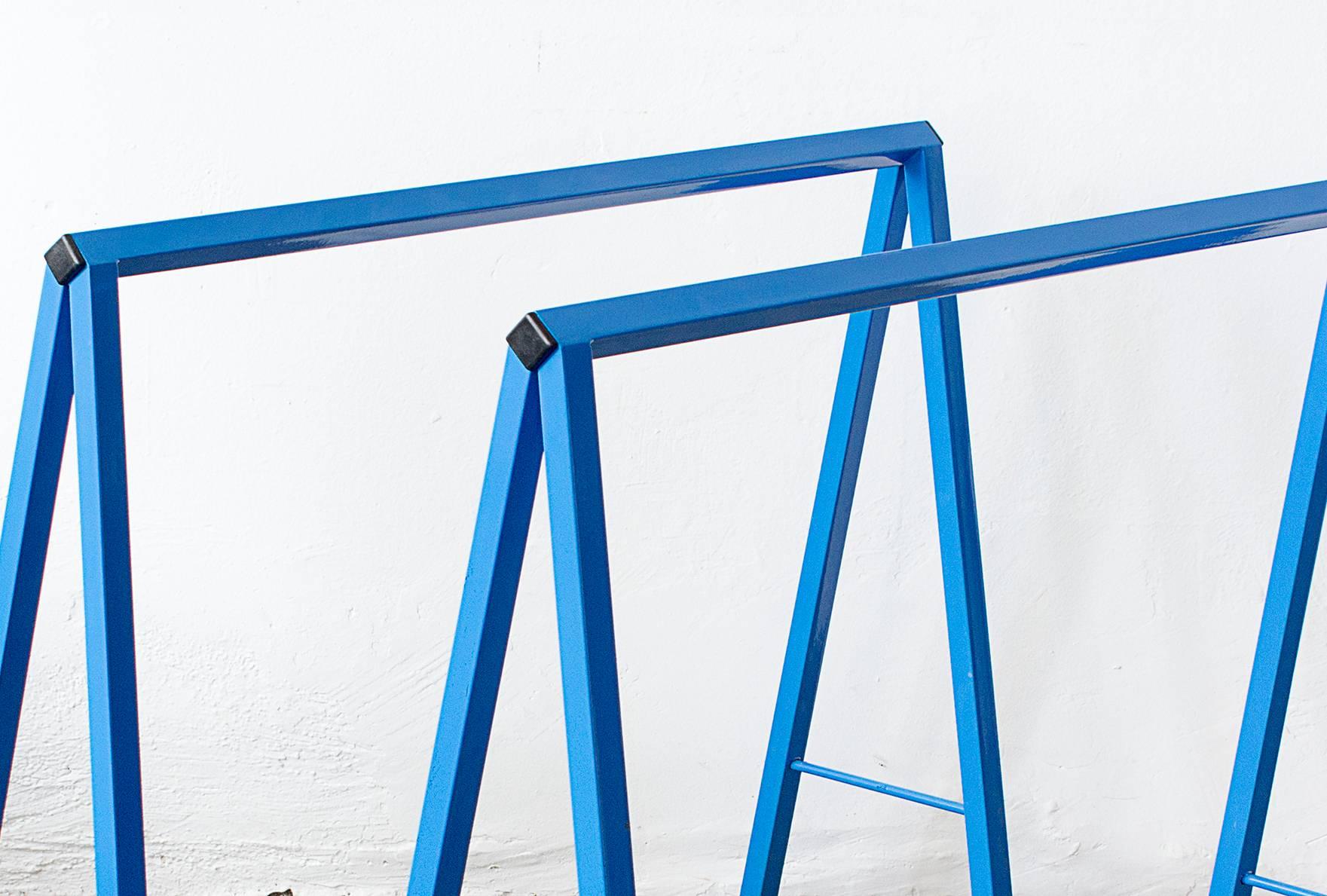We put a spin on our vintage steel A-frame table legs! This excellent pair is newly refinished with a bright "m&m blue" powder-coat. Finish your A-frame with a cut of glass, stone or reclaimed wood for a modular table of any width.