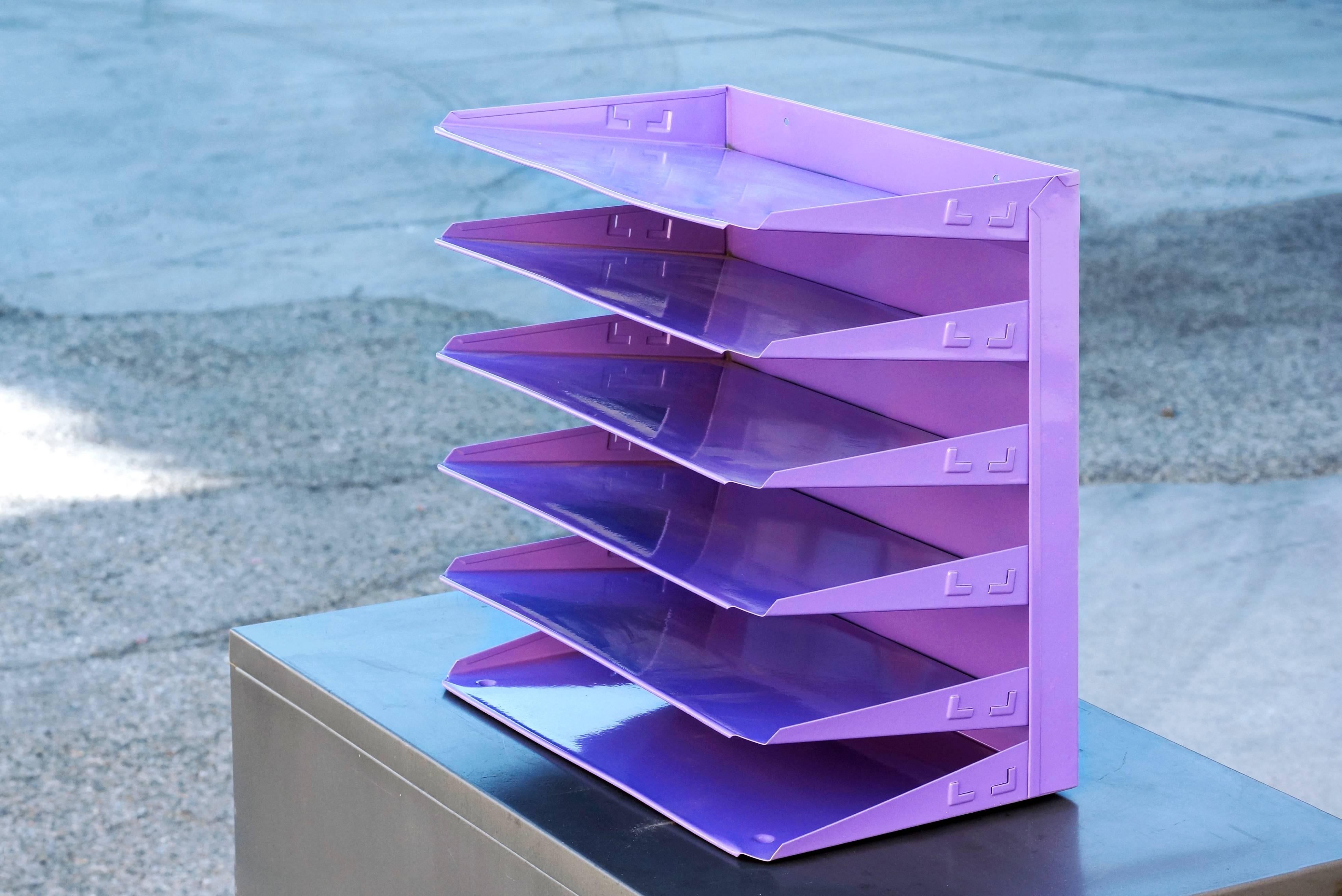 1970s retro office file or magazine holder stripped and freshly powder coated in high gloss lilac. Features six paper slots sure to keep your Mid-Century Modern desk in tip-top shape. Easily wall-mounts.

Dimensions: 9