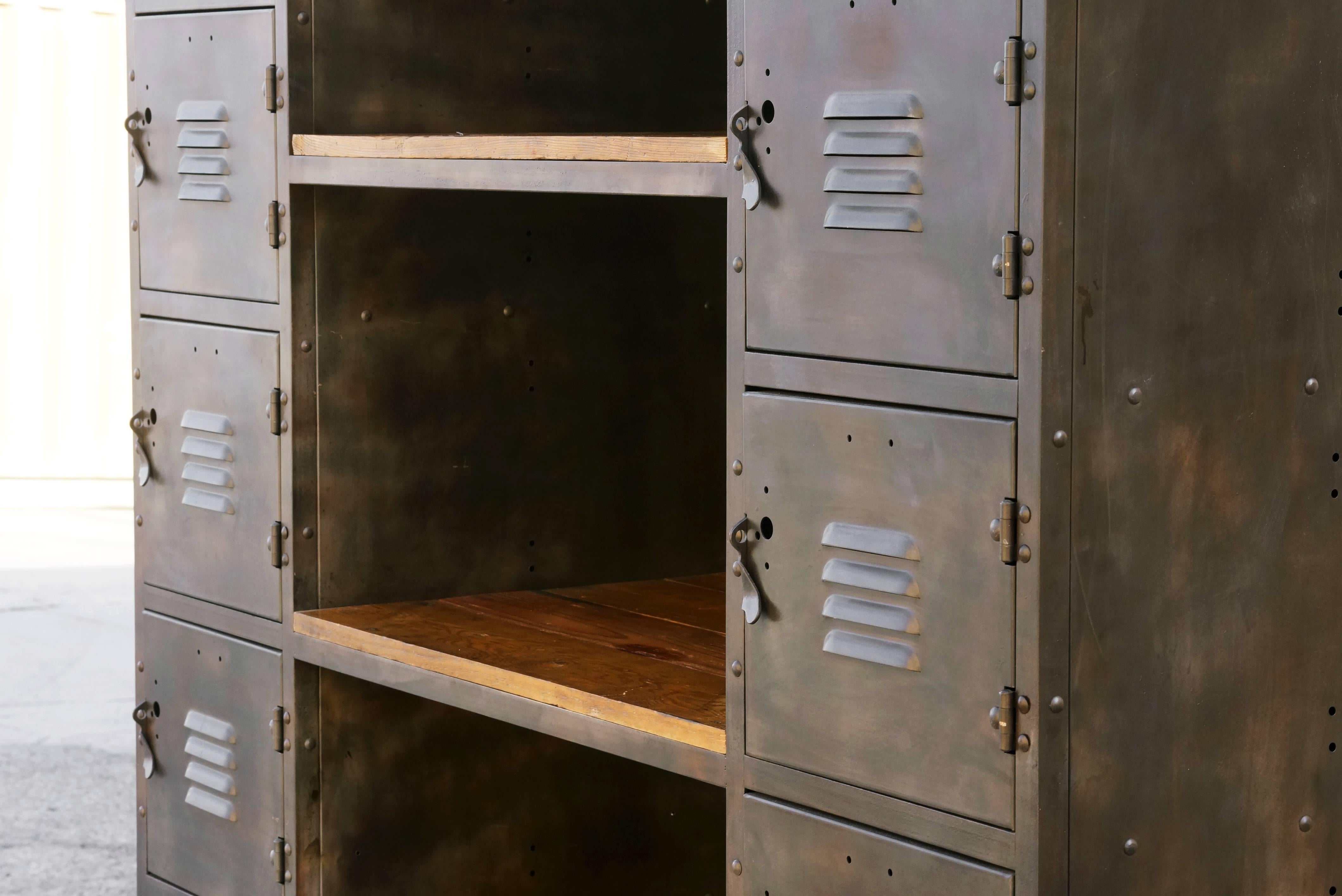 Absolutely gorgeous two column cubby locker and shelf unit. Our custom unit features an acid etched steel patina and reclaimed barn wood. Built with 12 lockable cubbies and four shelves. Rolls on casters. 

This multifunctional piece is a great