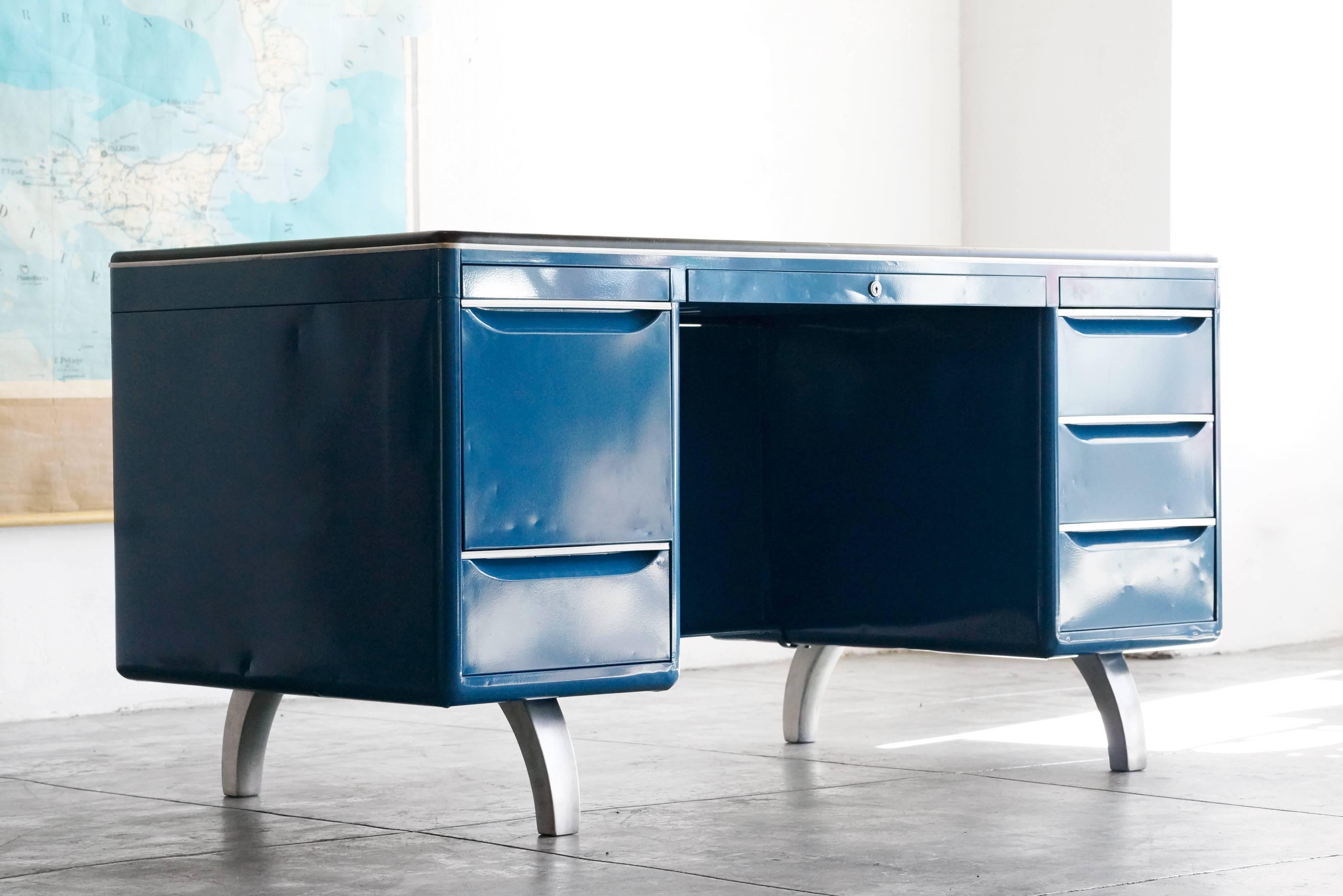 Rare double pedestal Mode Maker, the iconic tanker desk designed by Raymond Loewy for General Fireproofing Co. Newly refinished in Moon Blue with a black linoleum top. Brushed aluminum hardware. Features ample storage space, filing and utility