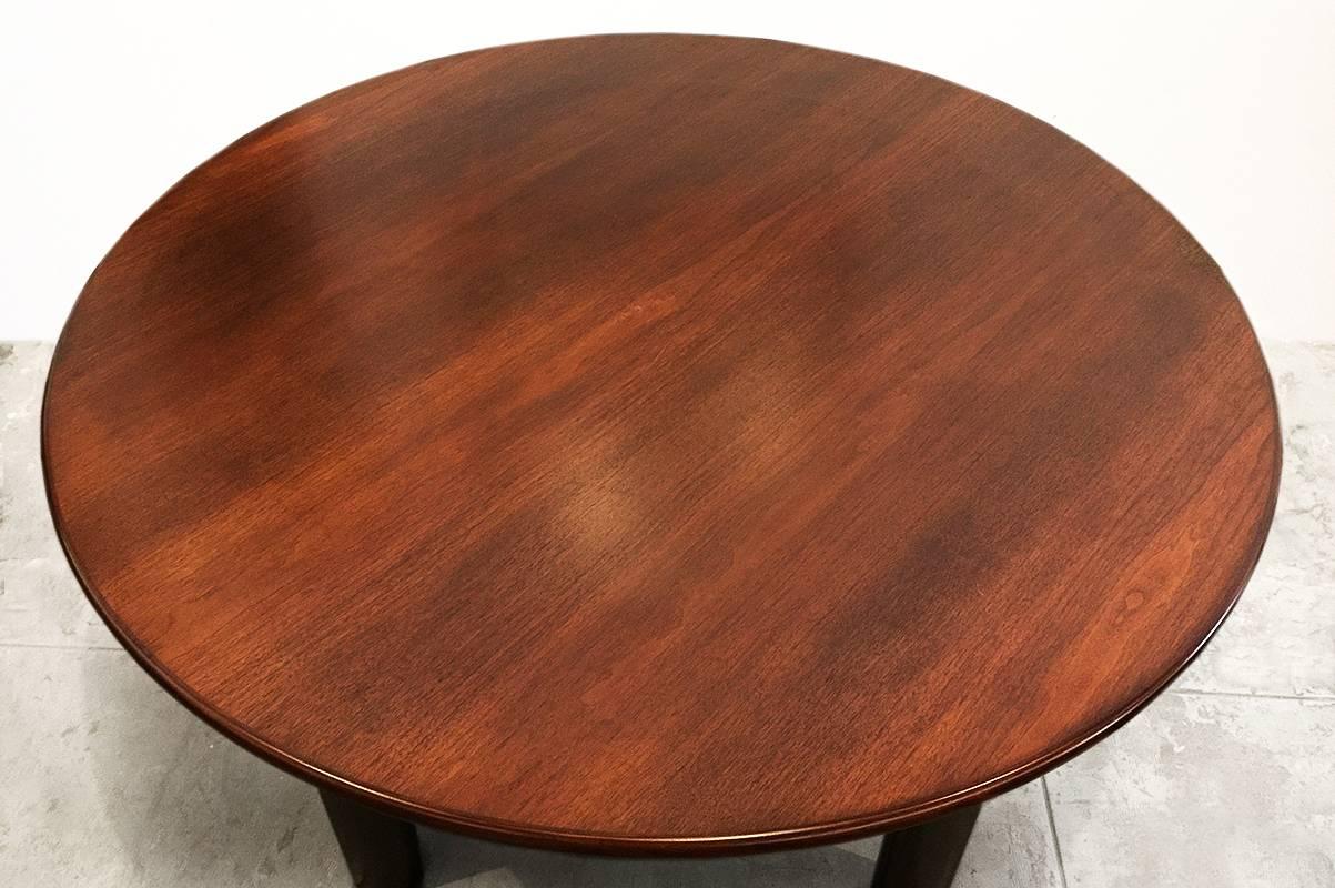 54" round walnut veneer conference table on stainless steel cylinder legs. Great for any contemporary or Mid-Century Modern environment. Can also be used for dining. Matching 10 foot conference table also available.

54" dia. x 30"