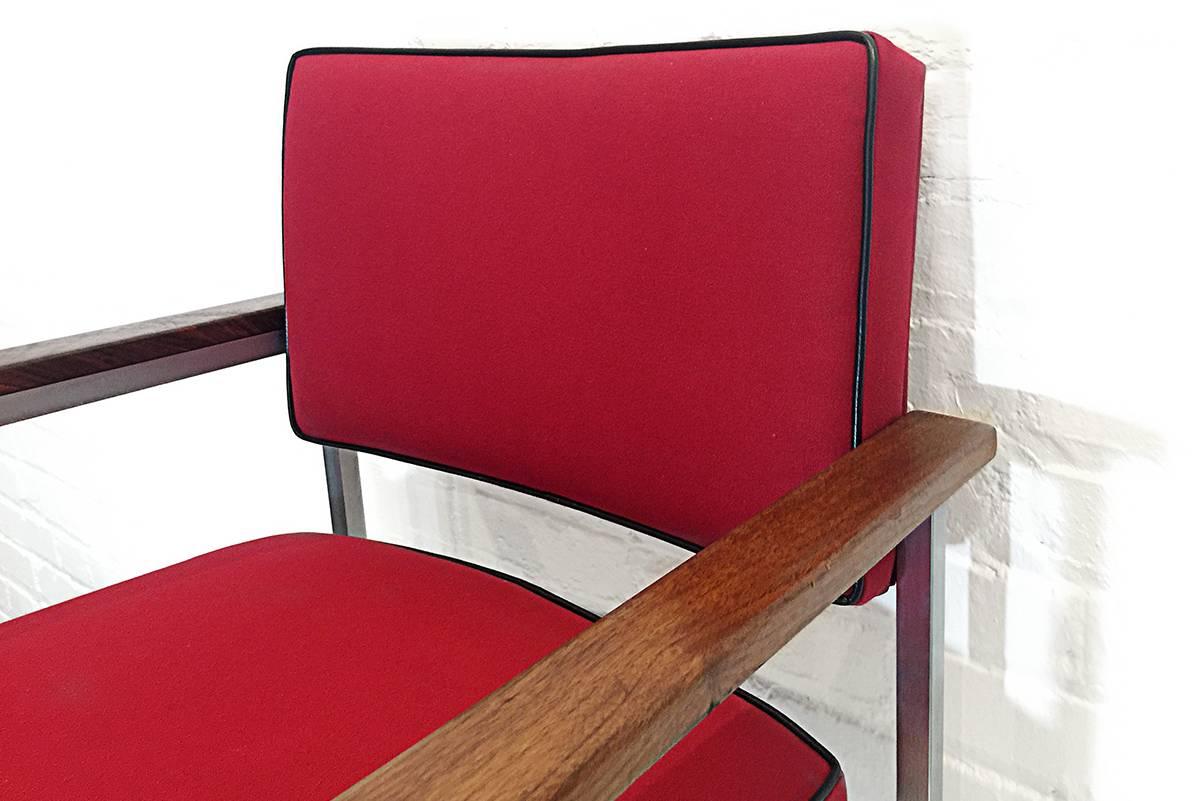 Sleek chrome square tube armchairs from the early 1980s. Reupholstered in heavy duty cotton duck. Walnut armrests. These workhorse chairs are perfect for a small conference table or lobby seating.

Dimensions: 19" D x 24" W x 34" H