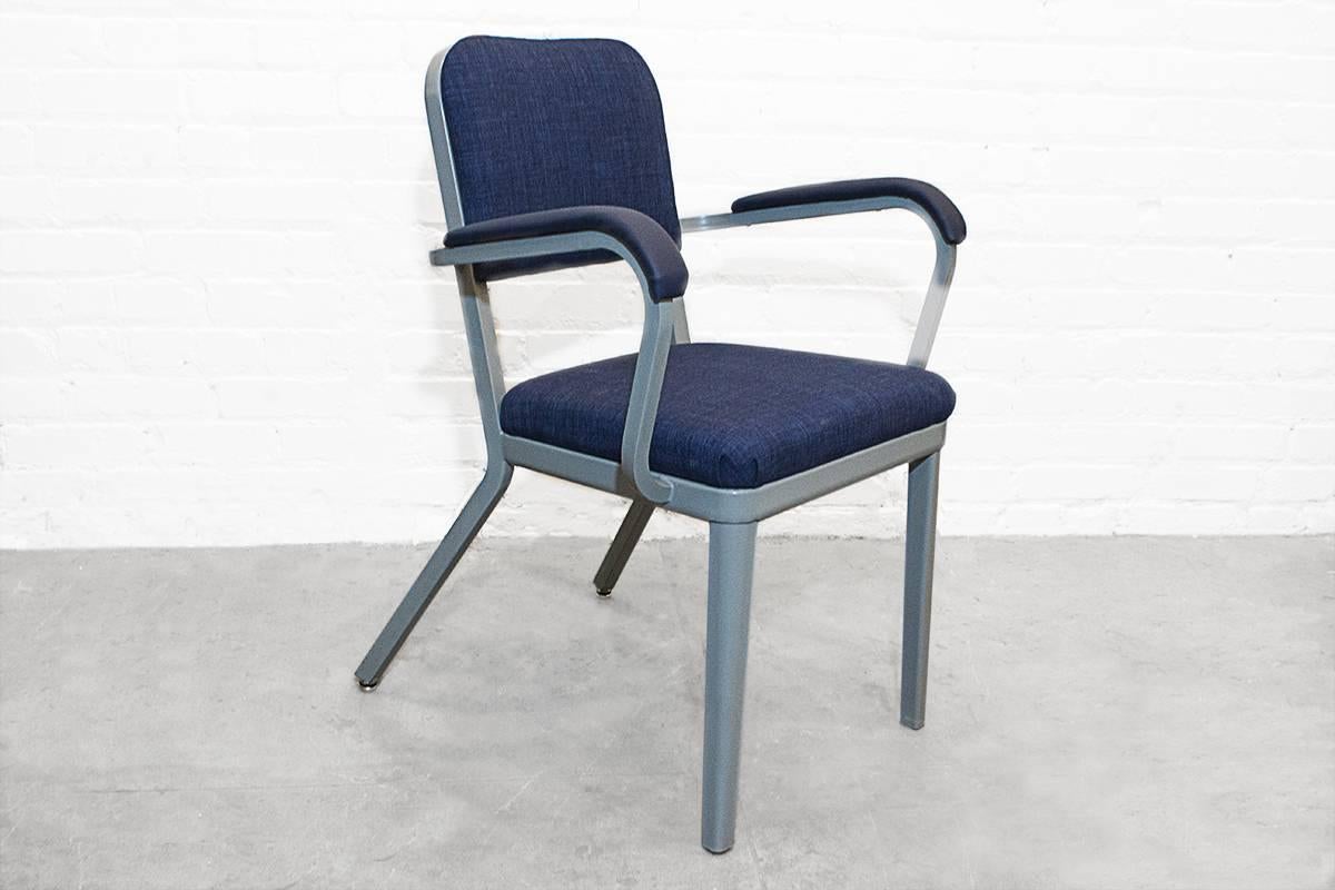 Two Cole Steel brand steel tanker armchairs newly refinished in medium gray powder coat finish and rich blue micro-linen fabric. Simple and sleek.

Dimensions: 17″ D x 22.5″ W x 32″ H x 18" seat height.