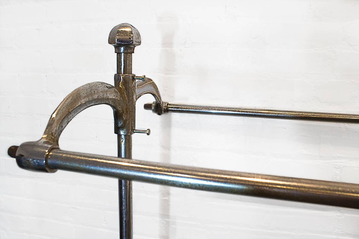 Very rare 1920s double-sided rolling clothing rack. Cast iron and chrome
finish is distressed, but looks great. Perfect for upscale clothing display.

Dimensions: 69