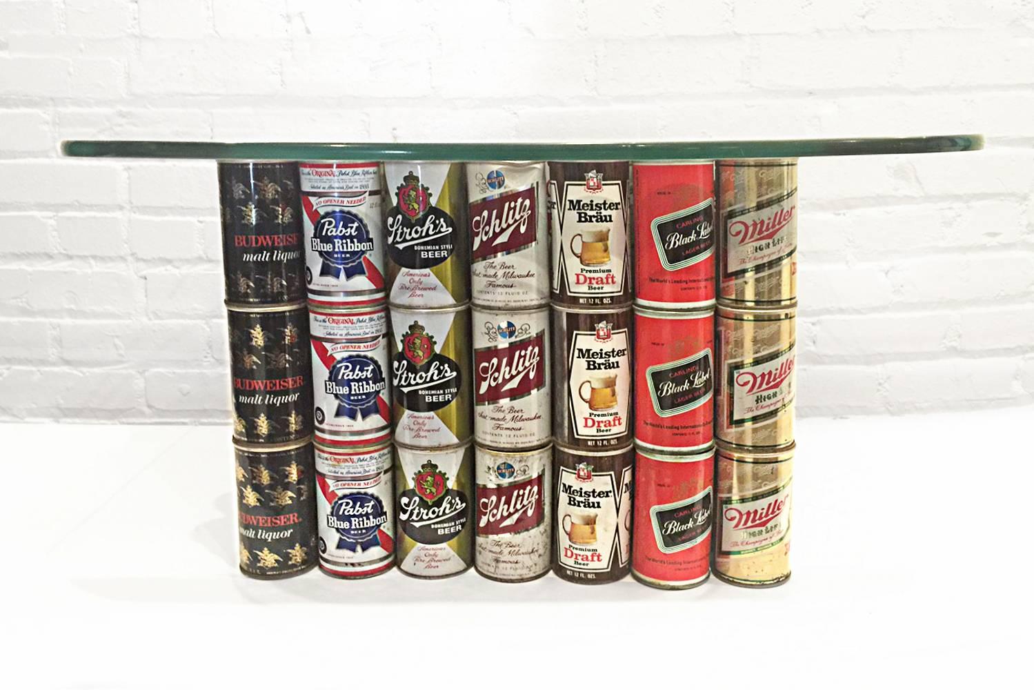 Absolute one of a kind Folk Art piece constructed of 147 vintage American beer cans. Brands include Budweiser, Schlitz, Strohs, Black Label, Iron City and several other classic beers from a bygone era. Superb Breweriana collectible.

Glass top not