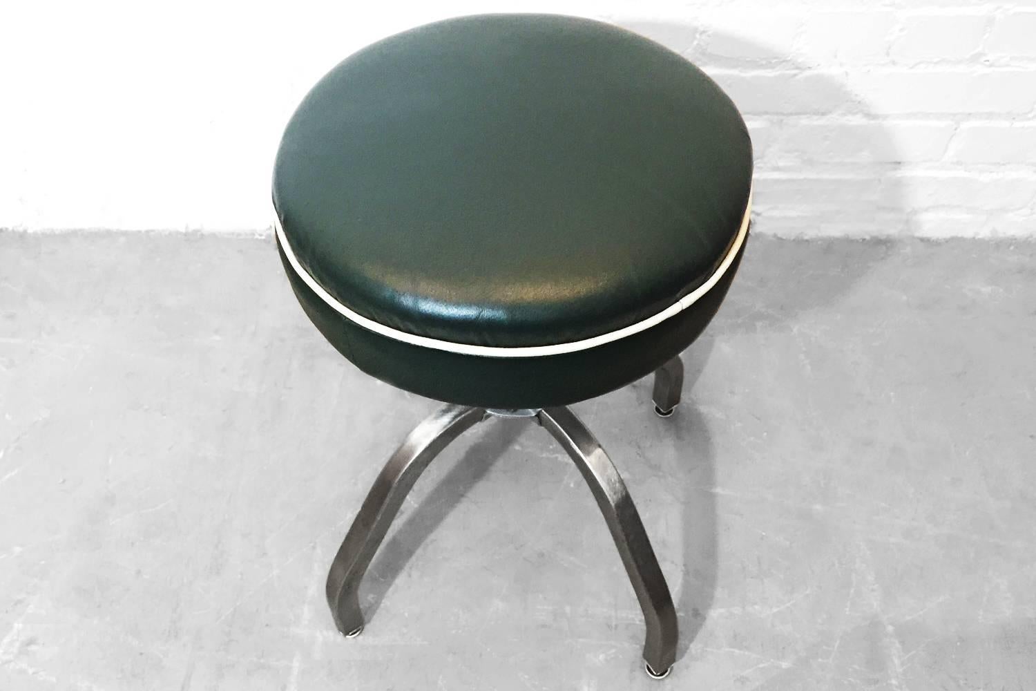 Very rare set of two vintage chrome salon stools from Buty-Crafters. These were rescued from a 70 yr old beauty supply manufacturing facility in Los Angeles.
Chrome has been brushed out and clear coated. Reupholstered in recycled dark green