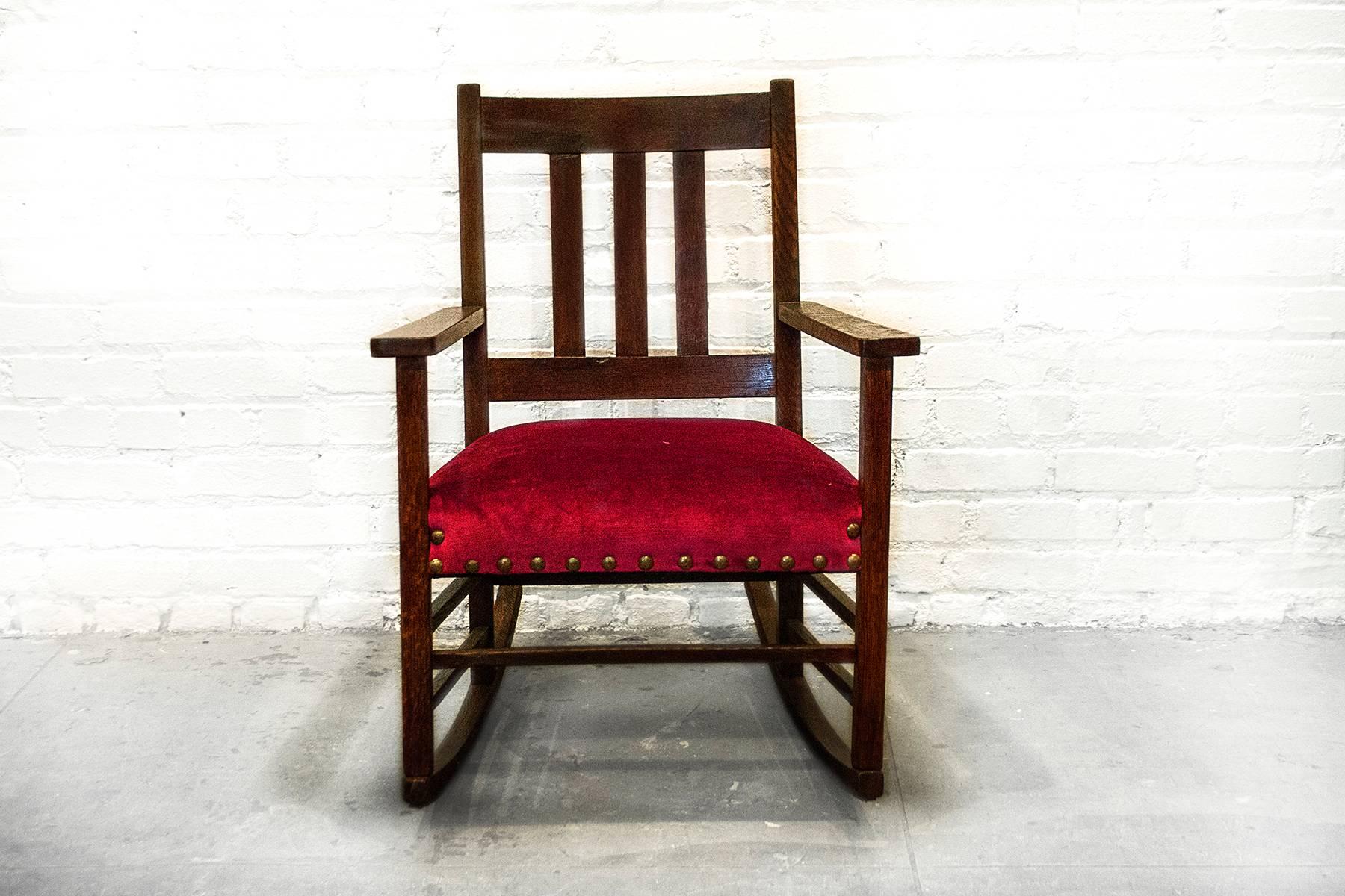 Reconditioned American Craftsman rocking chair with new red velvet fabric and anodized upholstery tacks. Front porch rockin' in comfort and style!

Dimensions: 20