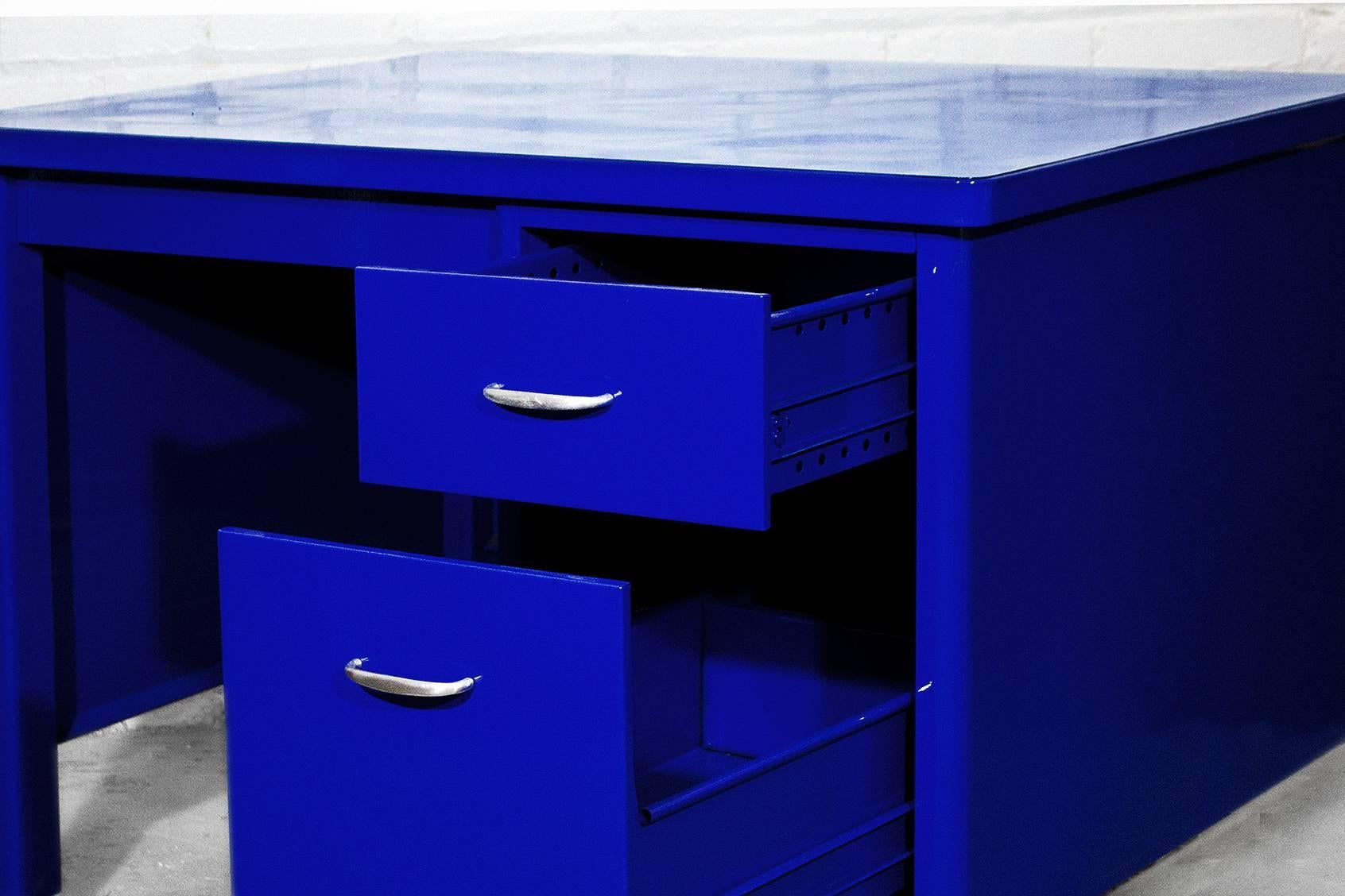 Rare Columbia brand single pedestal desk newly refinished in "electric" blue powder coat. File drawer, utility drawer and pencil drawer. Brushed aluminum hardware. Great for the kid's room or for retail merchandising.

Dimensions: