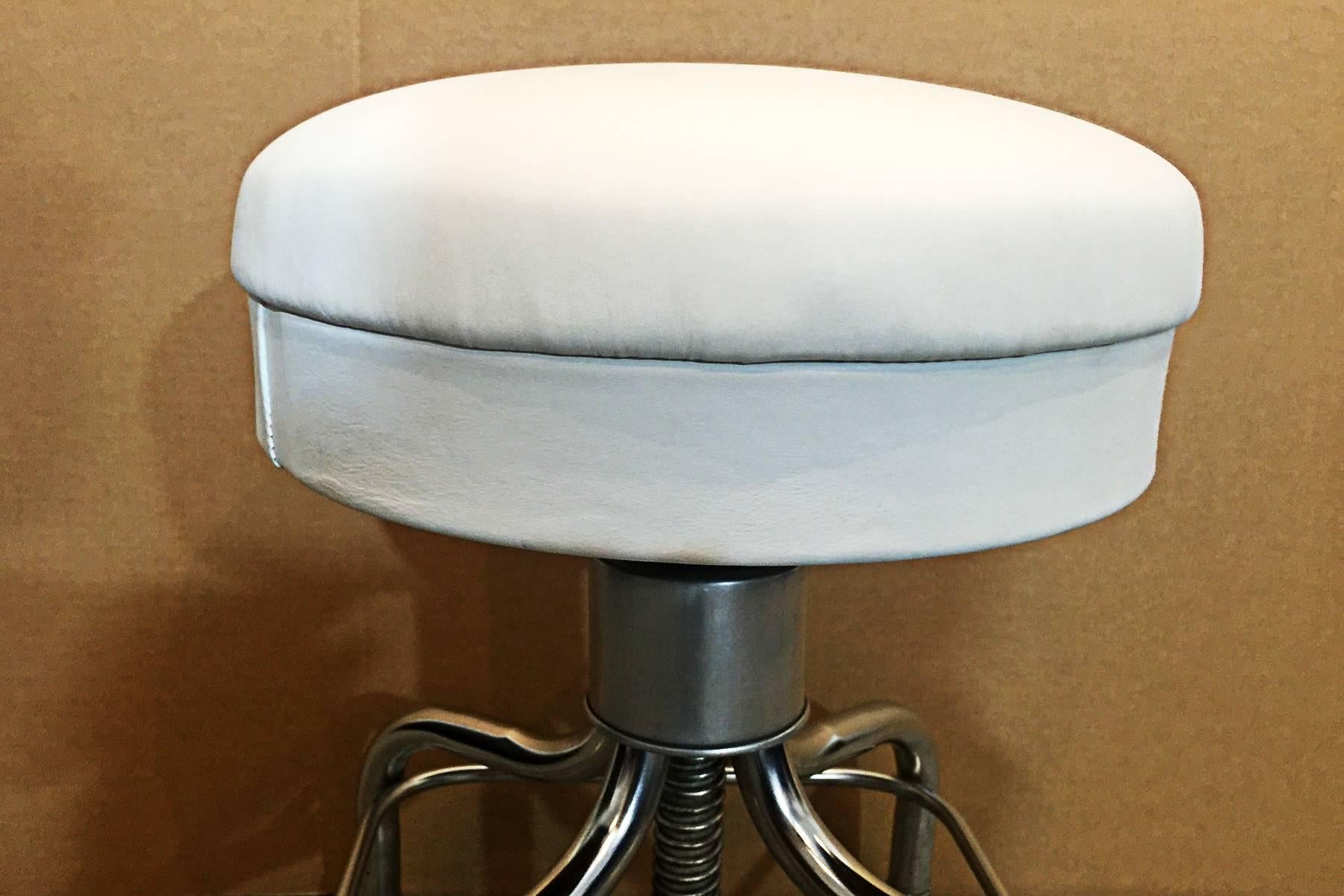 Pedigo brand chrome medical stool reupholstered in white leather. An American Classic for the home or office.

 Dimensions: 20.5