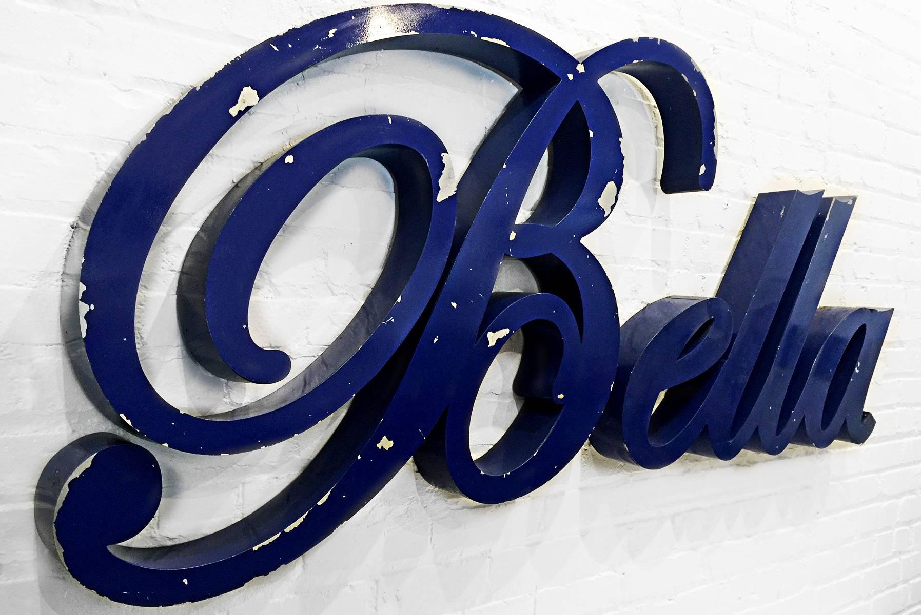 Super swooping script "Bella" sign in distressed blue finish. Great for someone named Bella, or if you just want to say "Beautiful"!! Awesome vintage wall art.
Bella bella!

Dimensions: 3.5" D x 69" W x 29" H.