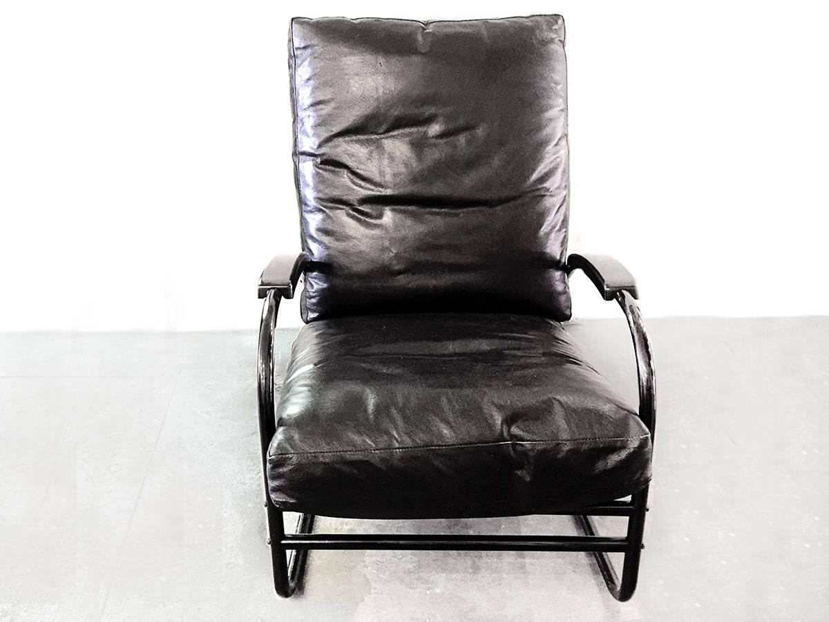Machine Age chrome tube armchair refinished in gloss black powder coat with vintage black leather upholstery. High gloss black arm caps. The "Darth Vader" version of an American Classic.

Dimensions: 37" D x 25.5" W x