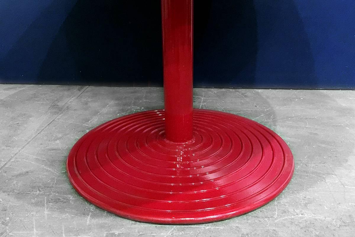 Rare stainless steel cafe table mounted on Art Deco style aluminium base. Tops have been machine brushed with circular patterns. Raised concentric circles add a great optical effect. Bright red powder coat base. Available in other colors.

Great