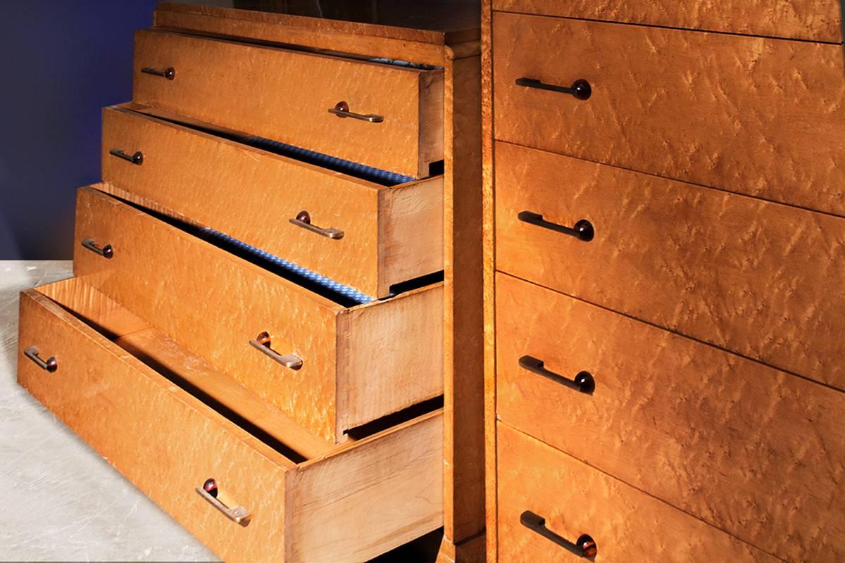 Fantastic set of two deco dressers, possibly English. Super high quality construction with gorgeous bird's-eye maple finish. Set consists of one chest of four drawers and one chest of fiver drawers. Fabulous brass and bakelite deco handles! 
Pieces