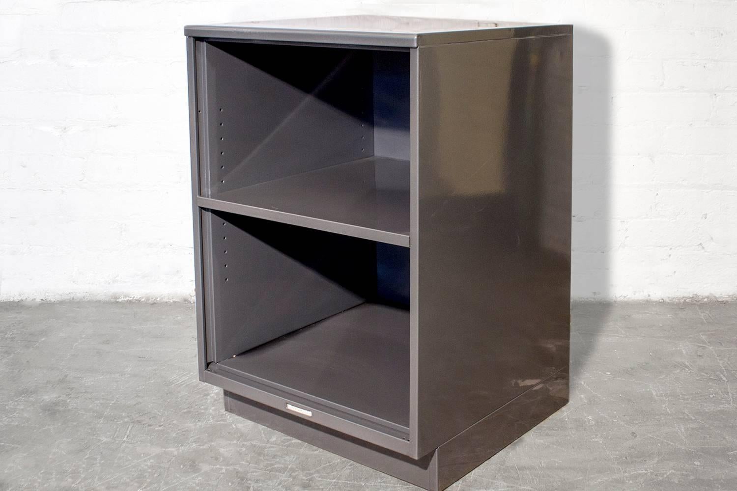 This 1960s Industrial "lowboy" cabinet by Steelcase is freshly powder-coated and in excellent condition. A versatile piece, it functions perfectly as an office cabinet, bedside table or anything in between. This All-American Steelcase is a