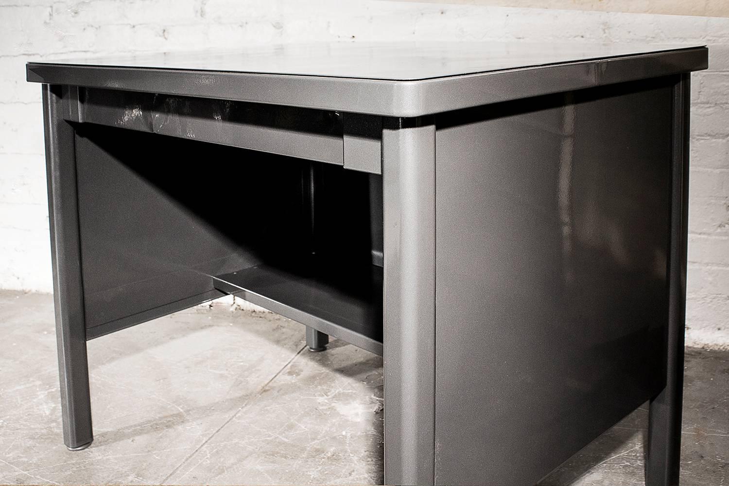 This excellent 1940s Industrial-era piece by the General Fireproofing Co. is a unique cross between a writing desk and work table. The 4-legged base features single utility drawer. Freshly powder-coated in grey. An equally perfect office reception