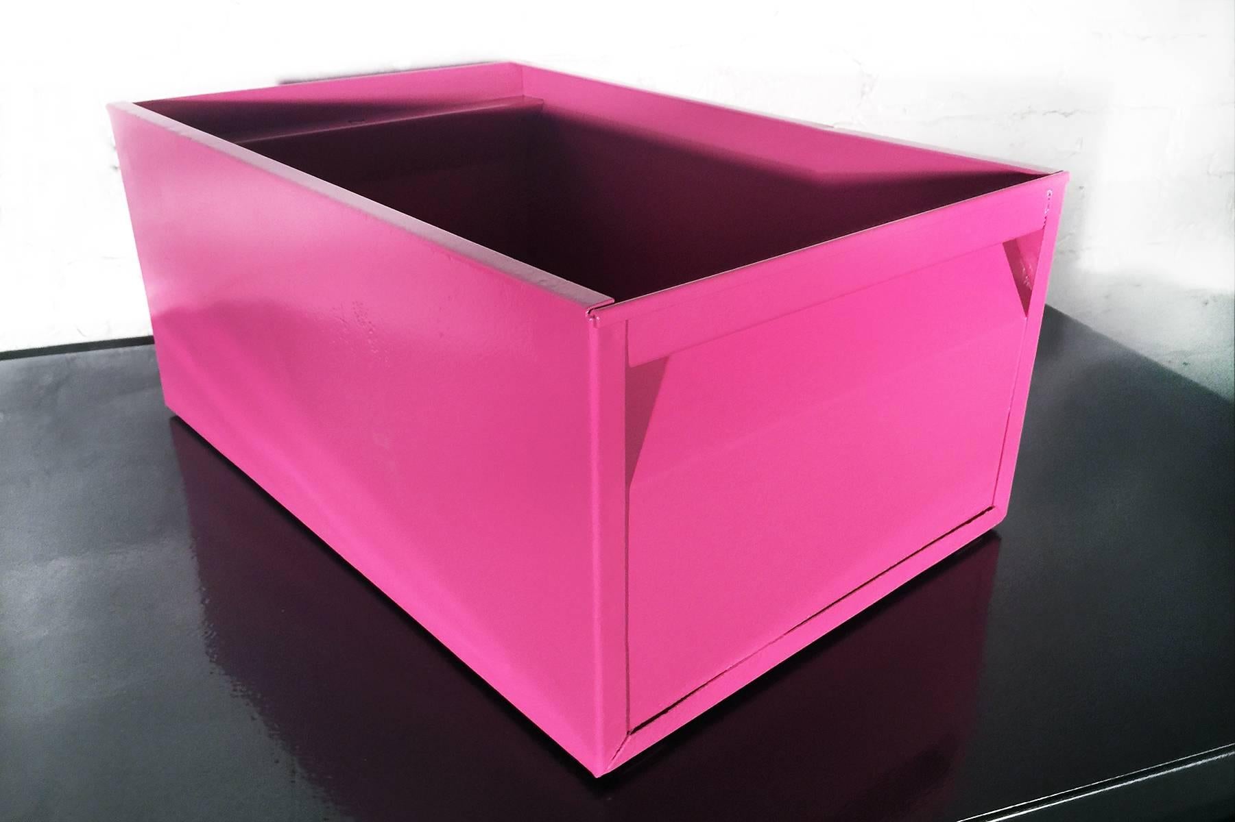 We refinished our fantastic 1940s, industrial storage bin in a gloss pink powder coat. This Classic, heavy-duty steel organizer is sure to keep your office in tip-top shape.