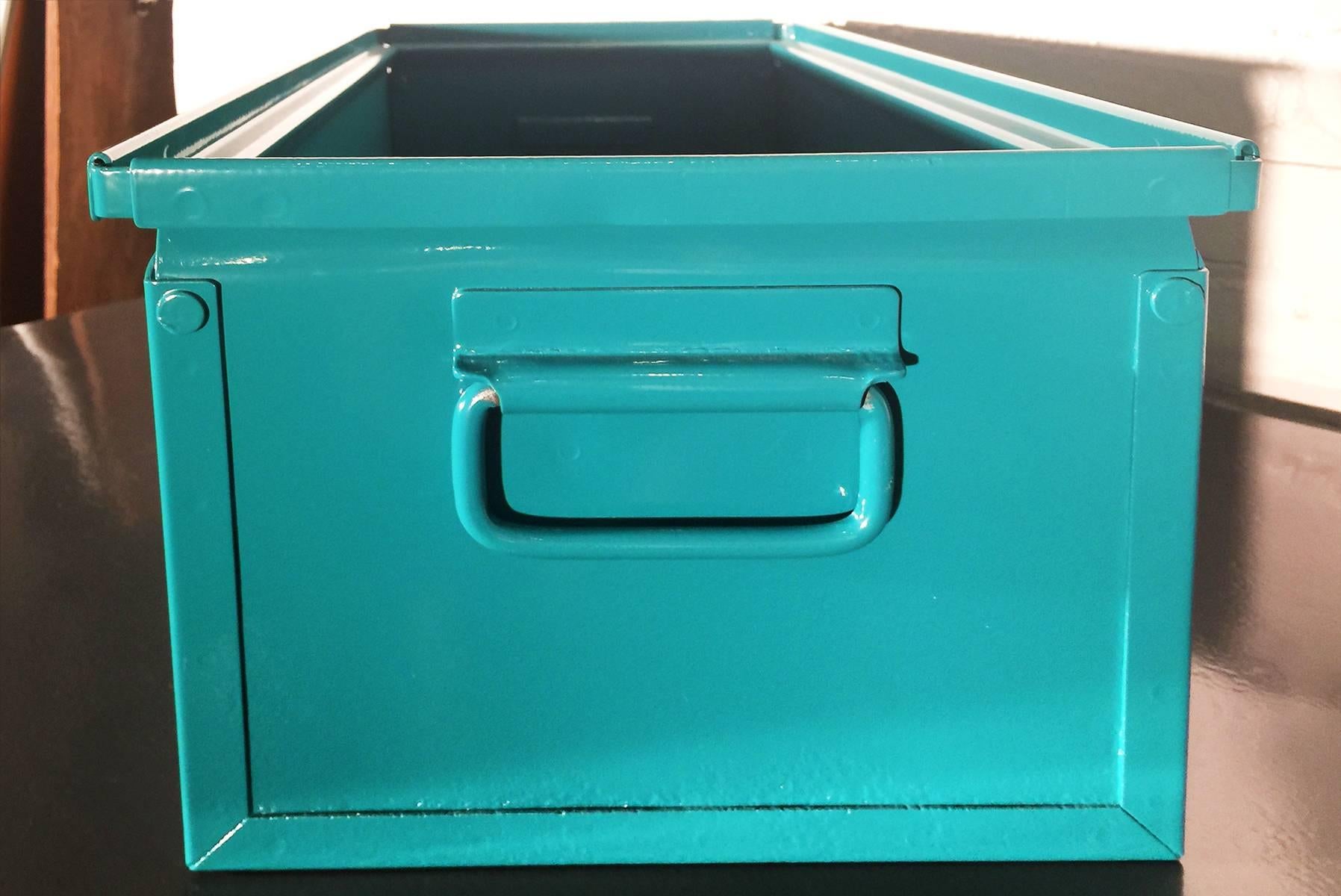 We refinished our fantastic 1940s Industrial storage bin in a gloss teal powder coat. This classic, heavy-duty steel organizer is sure to keep your office in tip-top shape.